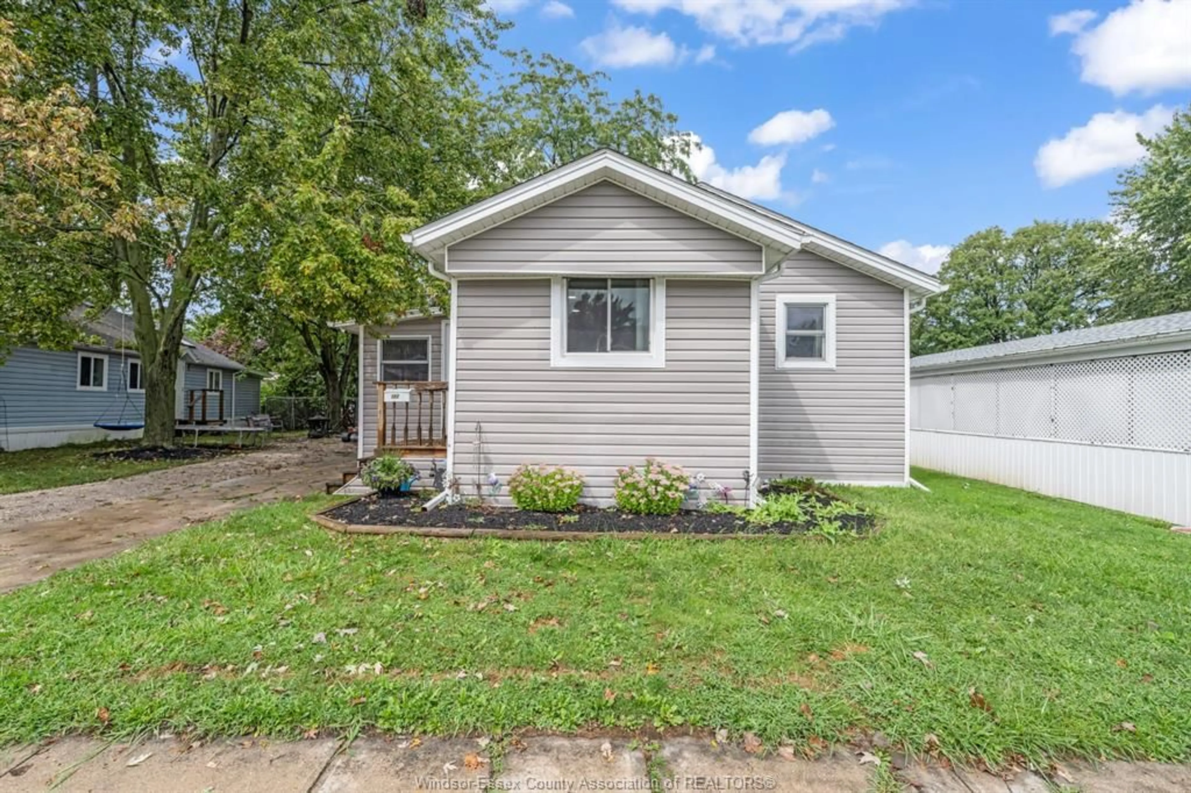 Home with vinyl exterior material, street for 152 DANA Dr, Essex Ontario N8M 2A5