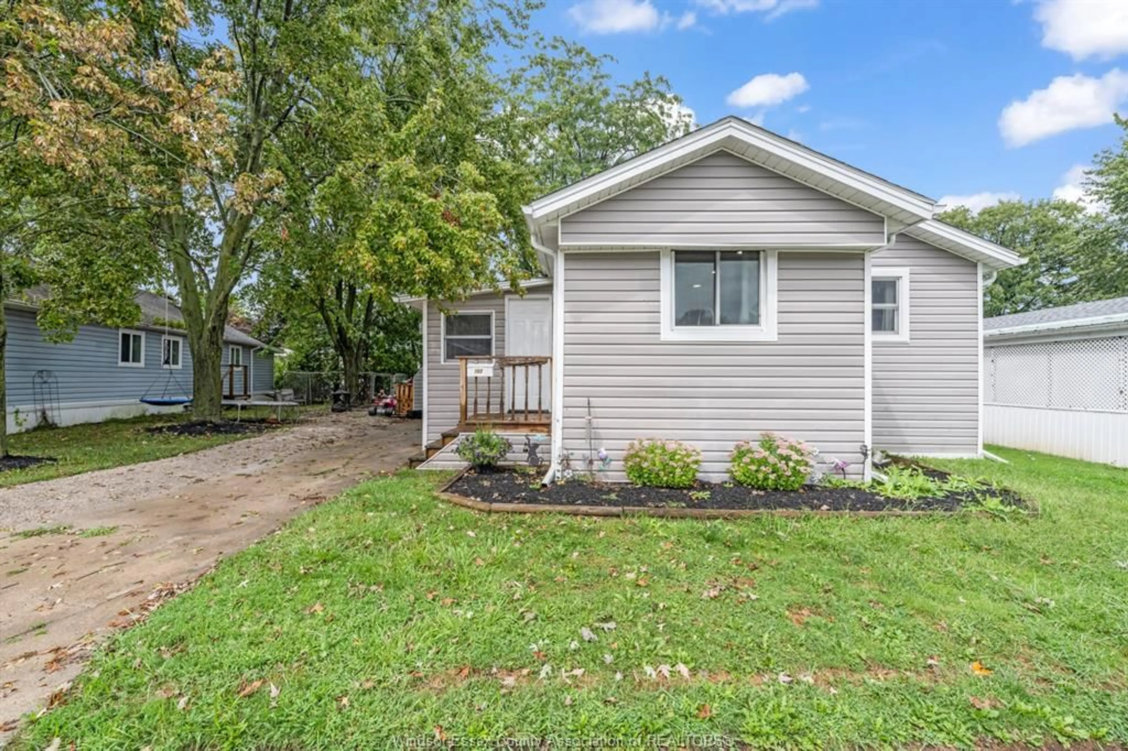 Home with vinyl exterior material, street for 152 DANA Dr, Essex Ontario N8M 2A5