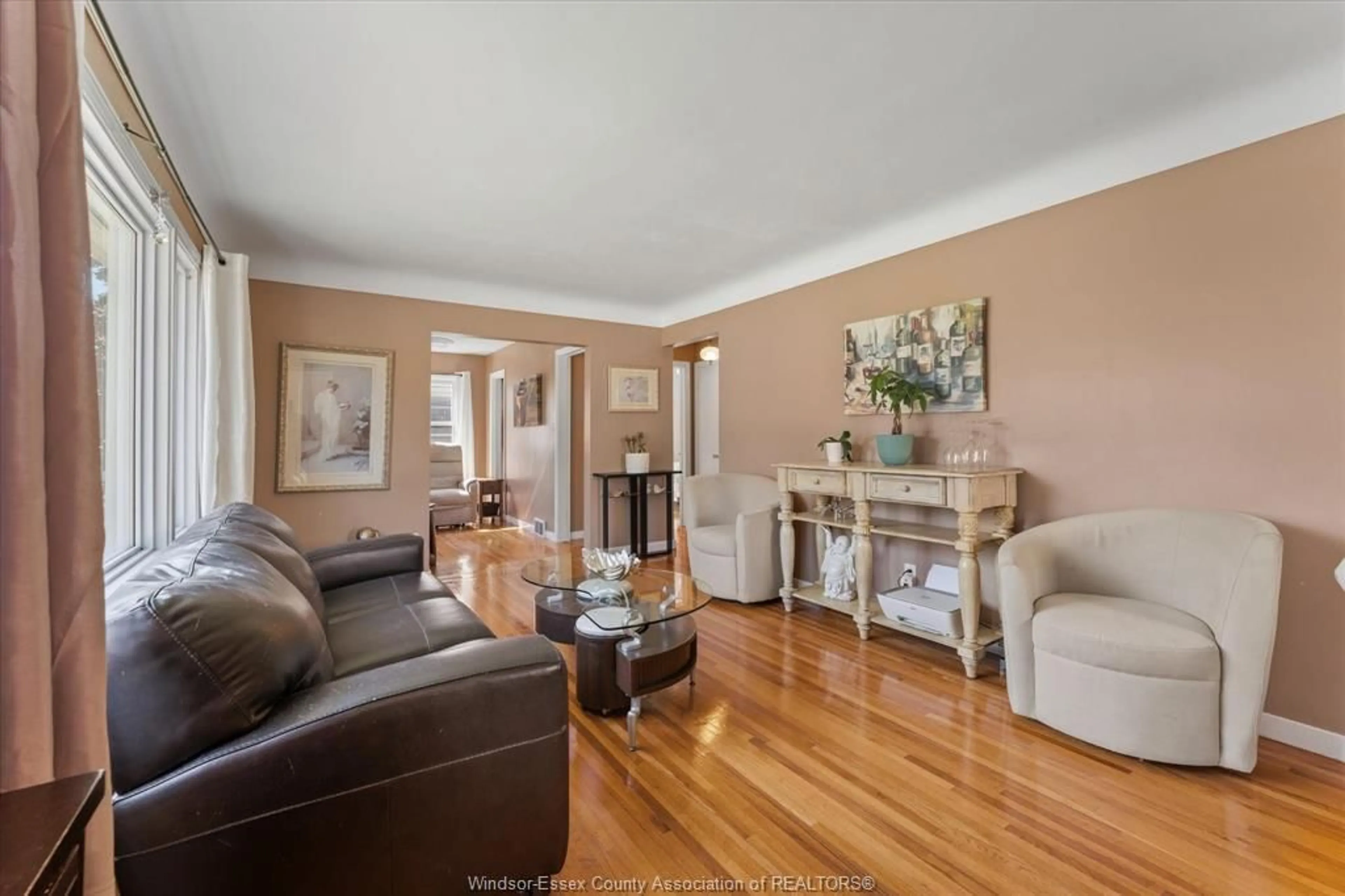 Living room with furniture, wood/laminate floor for 971 Isabelle Pl, Windsor Ontario N8S 3B1