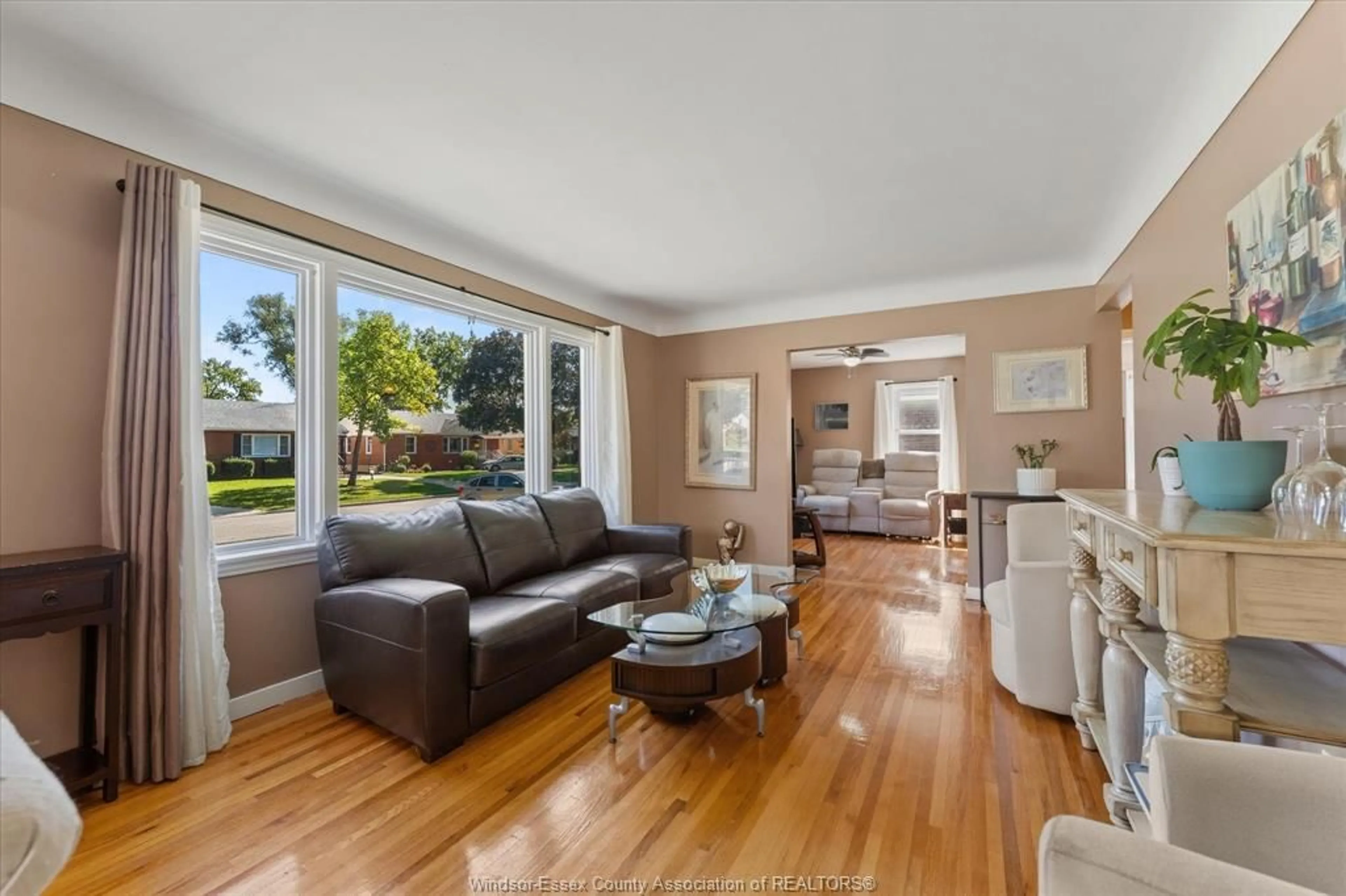 Living room with furniture, wood/laminate floor for 971 Isabelle Pl, Windsor Ontario N8S 3B1