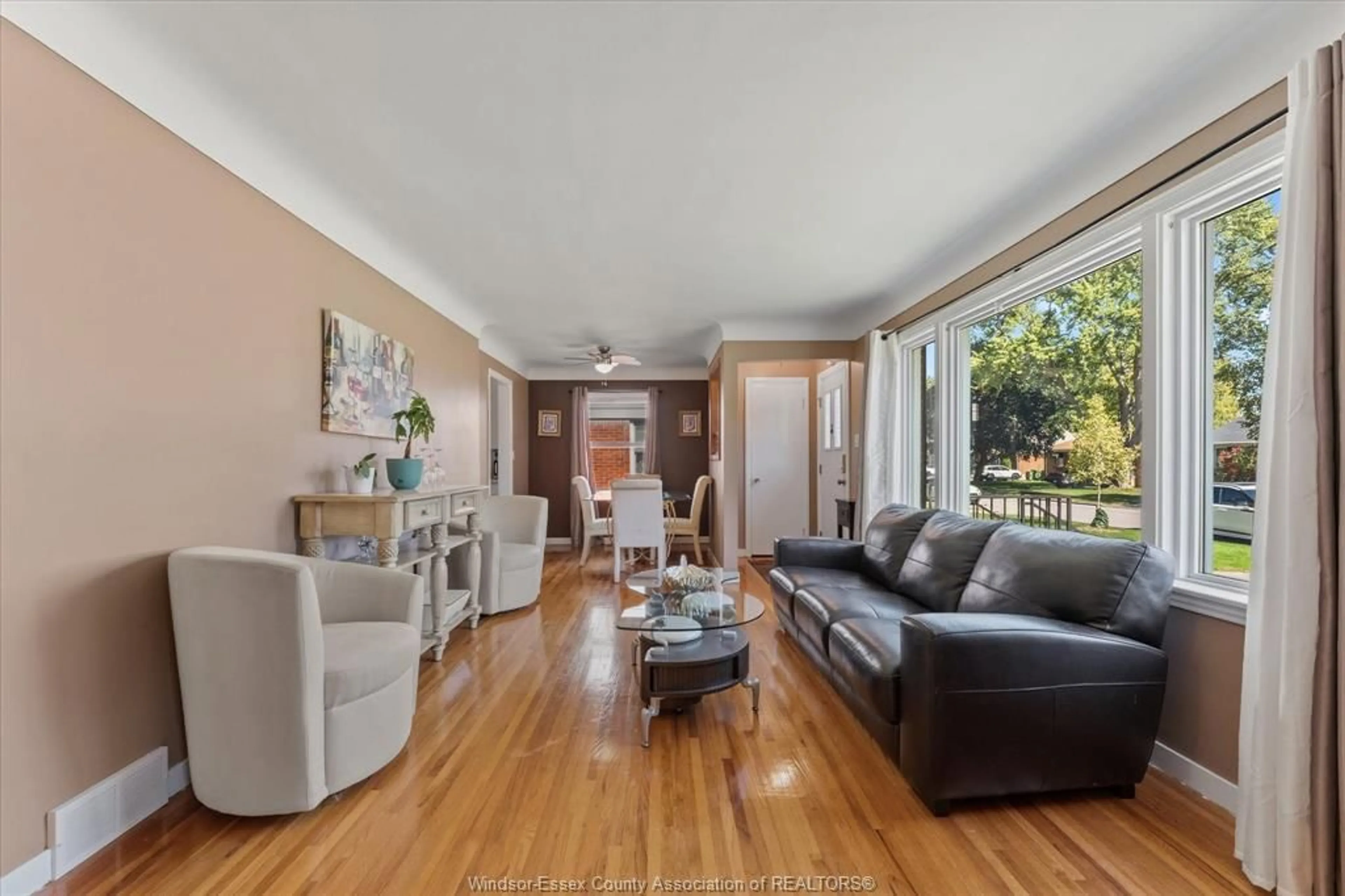 Living room with furniture, wood/laminate floor for 971 Isabelle Pl, Windsor Ontario N8S 3B1