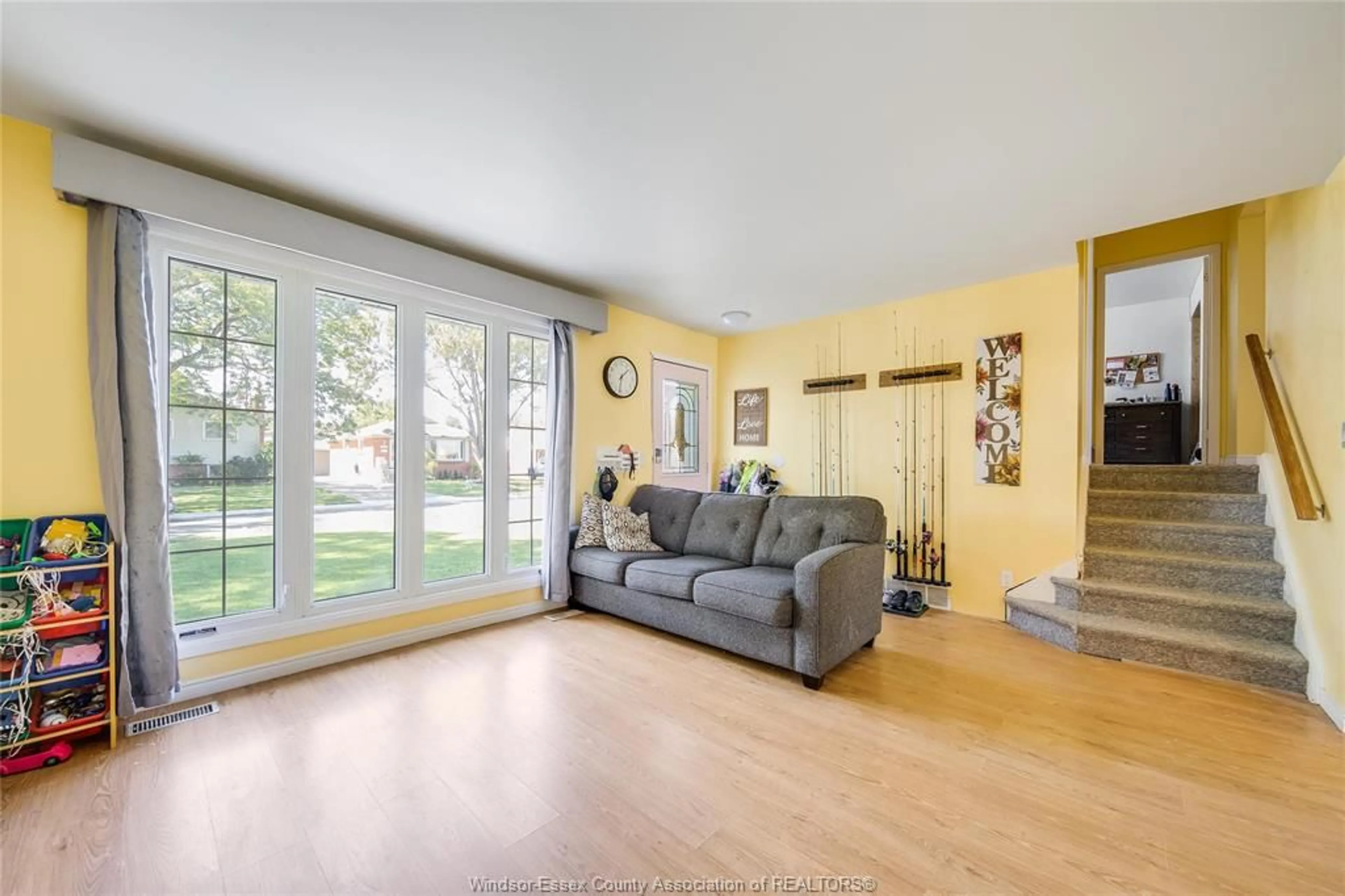 Living room with furniture, wood/laminate floor for 368 CARLING Cres, Windsor Ontario N8S 3X8