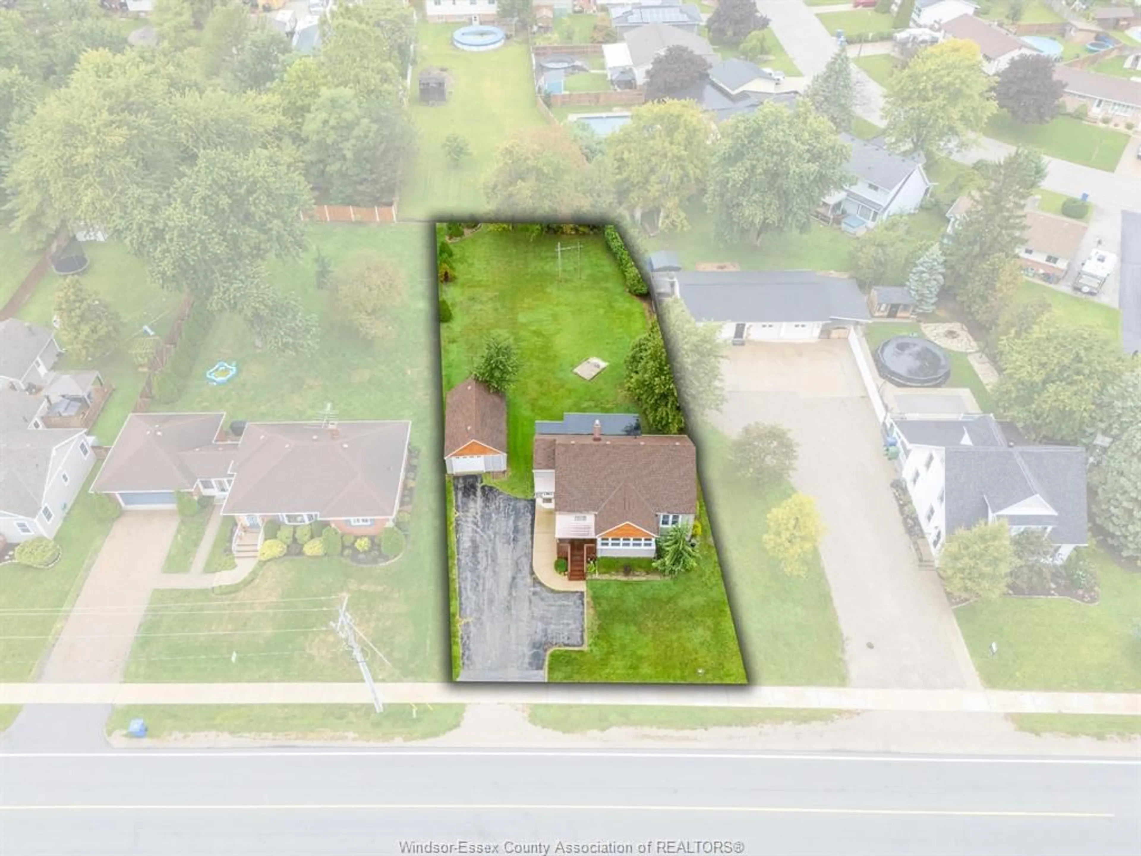 A pic from outside/outdoor area/front of a property/back of a property/a pic from drone, street for 147 County Road 27, Cottam Ontario N0R 1B0
