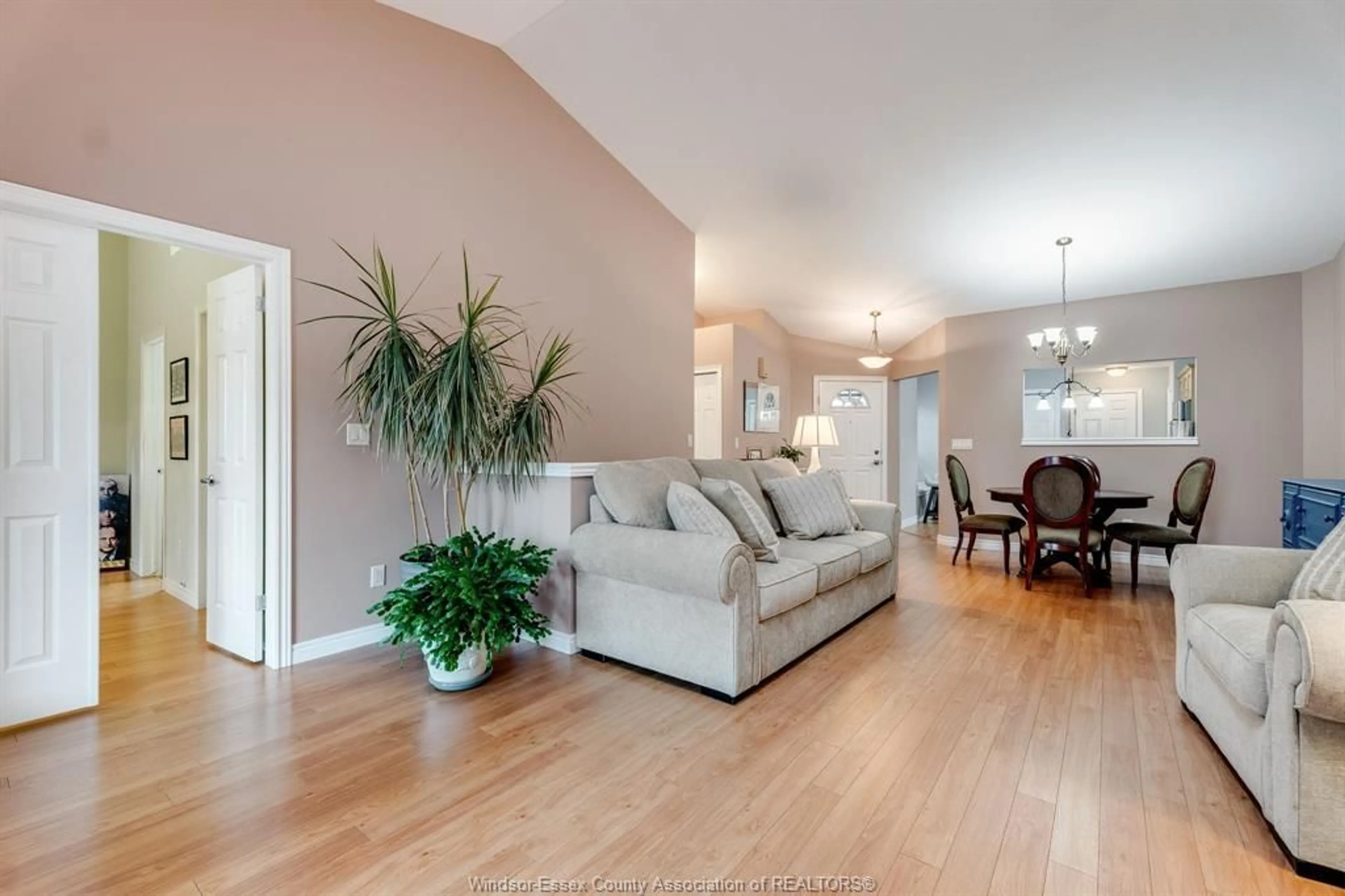 Living room with furniture, wood/laminate floor for 13 Leonard Dr, Kingsville Ontario N9Y 4G4