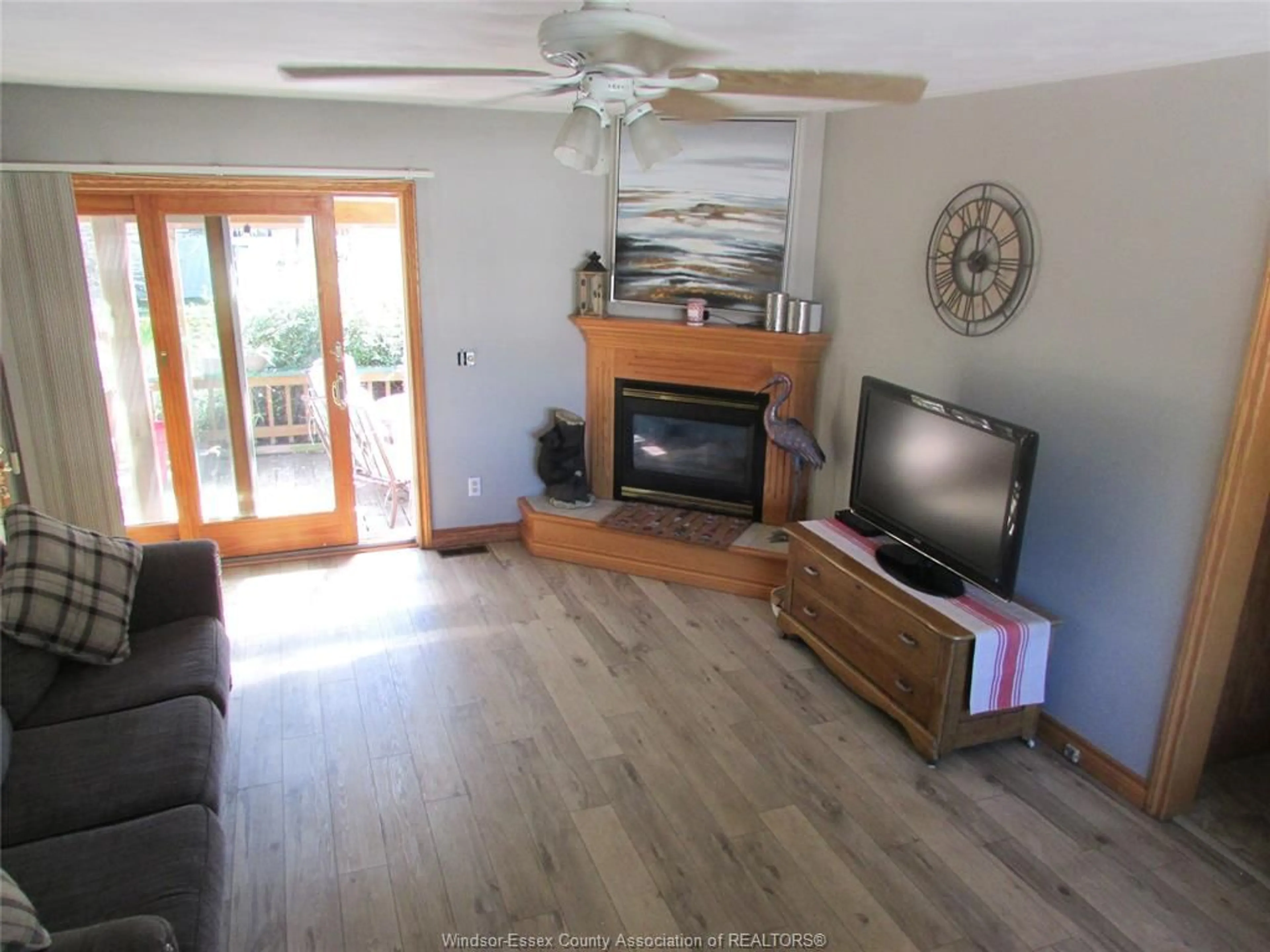 Living room with furniture, wood/laminate floor for 127 Baird Ave, Wheatley Ontario N0P 2P0