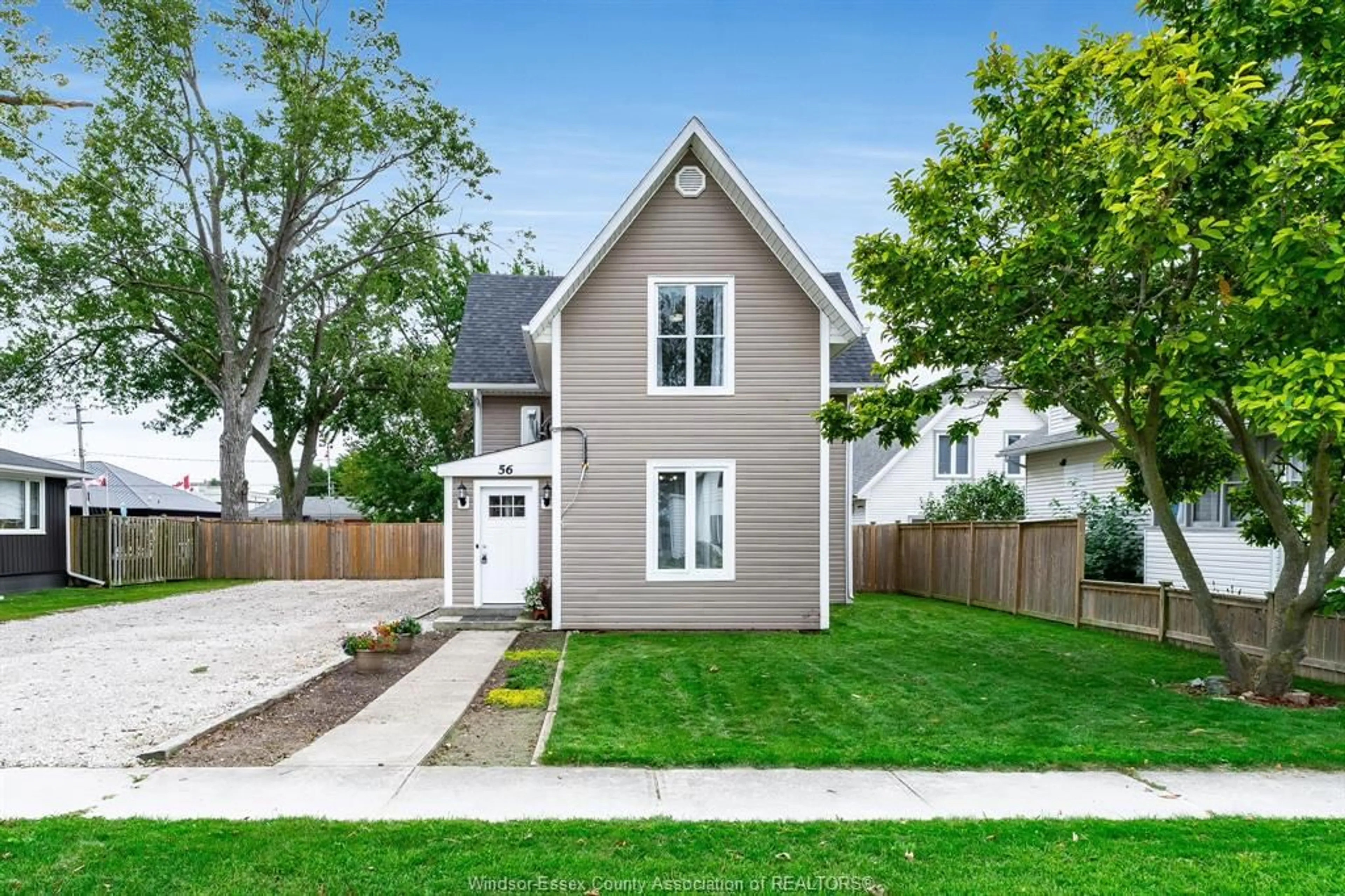 Home with vinyl exterior material, street for 56 Foster St, Wheatley Ontario N0P 2P0
