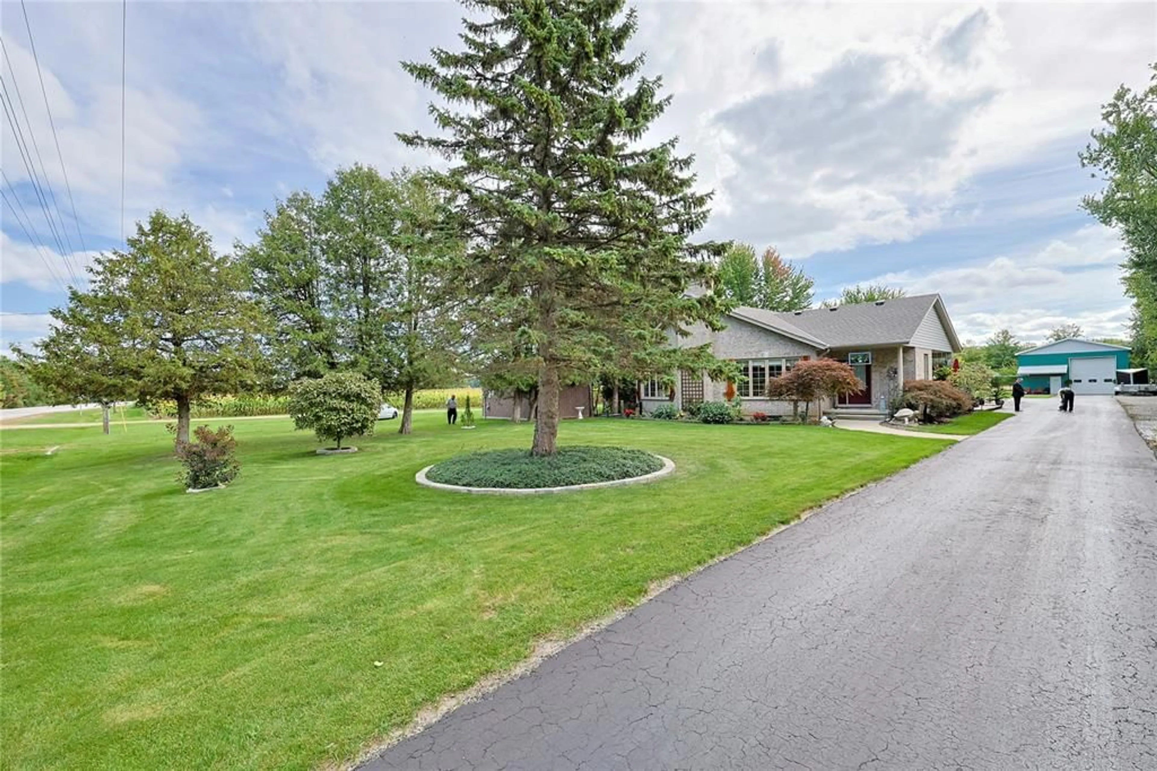A pic from outside/outdoor area/front of a property/back of a property/a pic from drone, mountain view for 5121 Lakeshore Rd, Plympton-Wyoming Ontario N0N 1J6