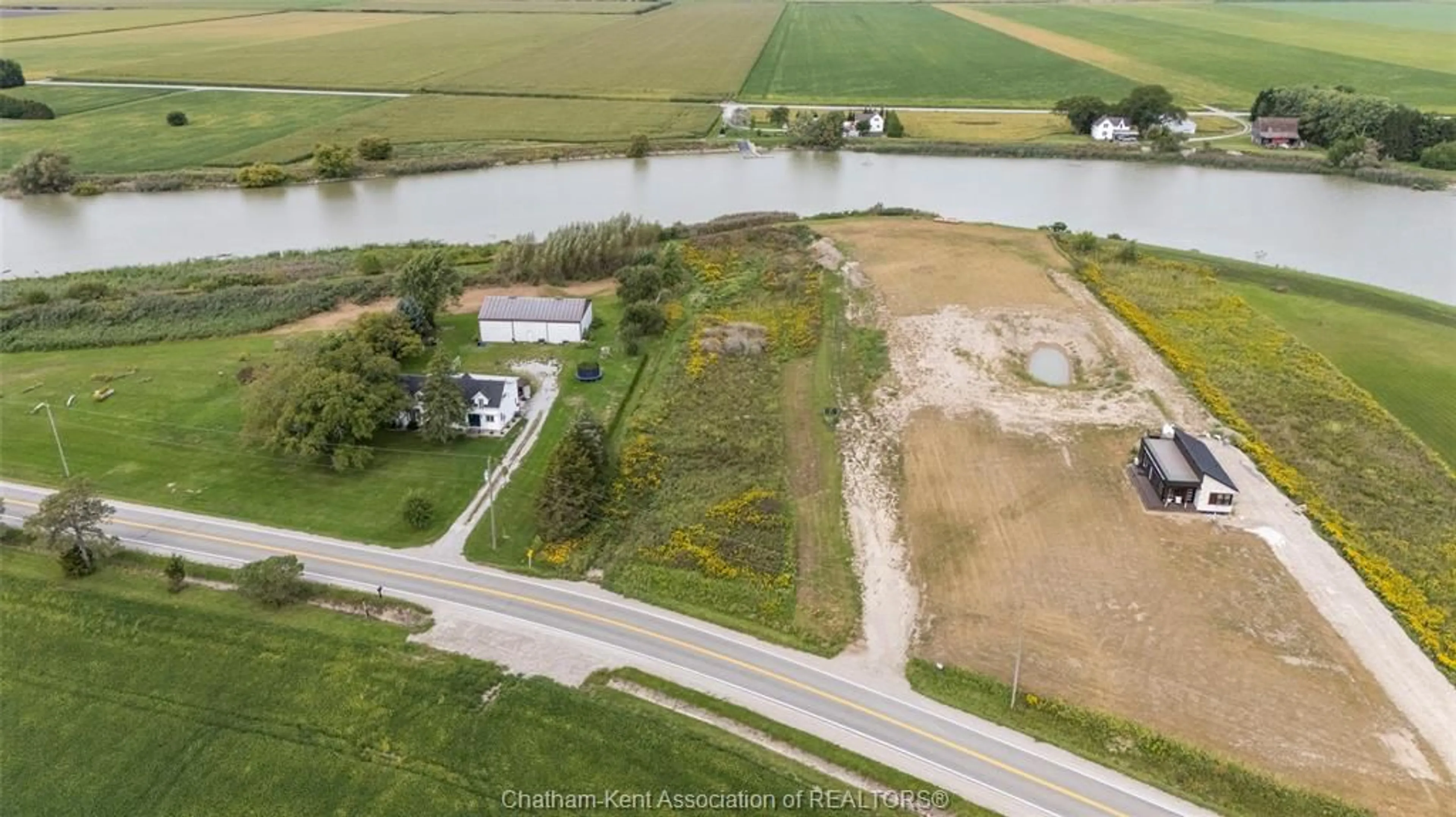 A pic from outside/outdoor area/front of a property/back of a property/a pic from drone, water/lake/river/ocean view for 5269 Tecumseh Line, Tilbury Ontario N0P 2L0