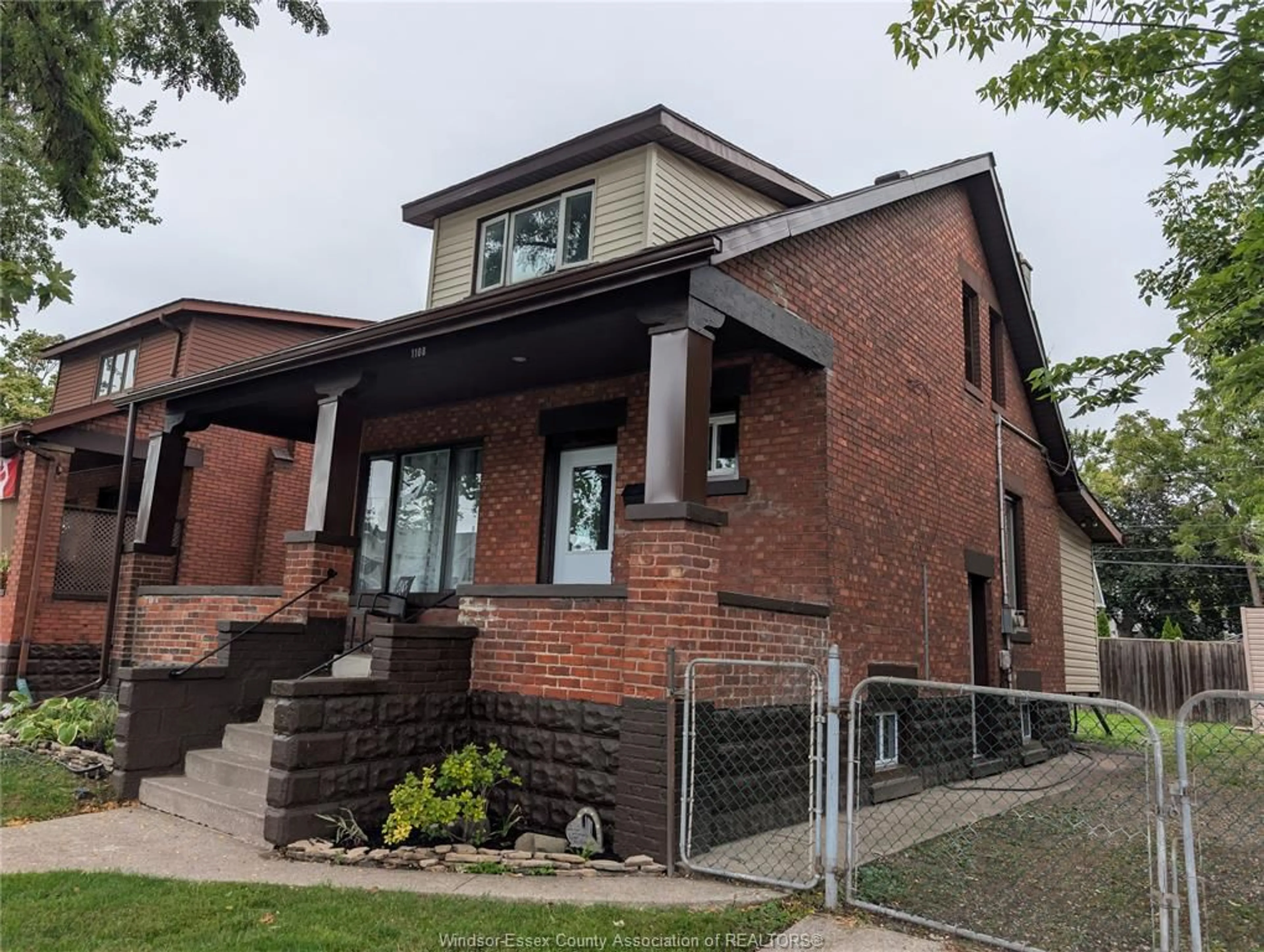 Home with brick exterior material, street for 1108 DOUGALL Ave, Windsor Ontario N9R 4R7