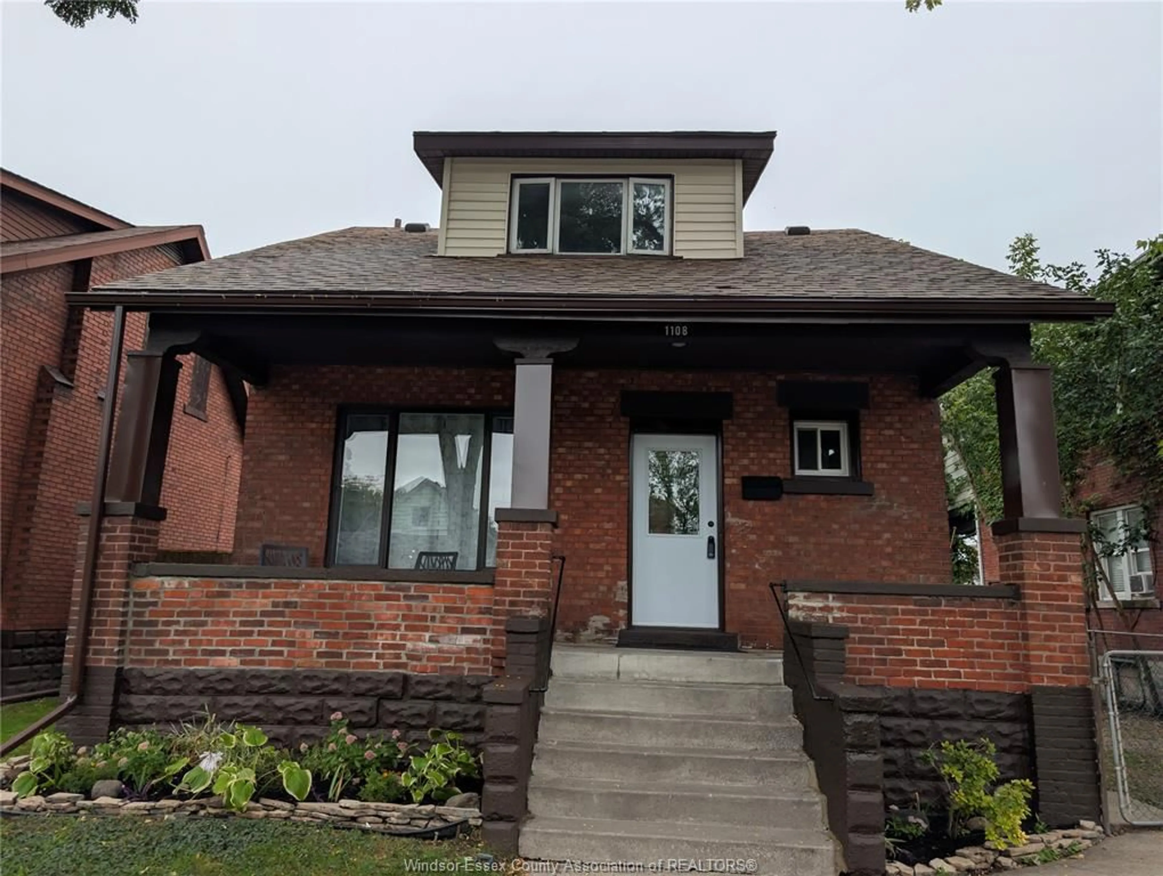 Home with brick exterior material, street for 1108 DOUGALL Ave, Windsor Ontario N9R 4R7