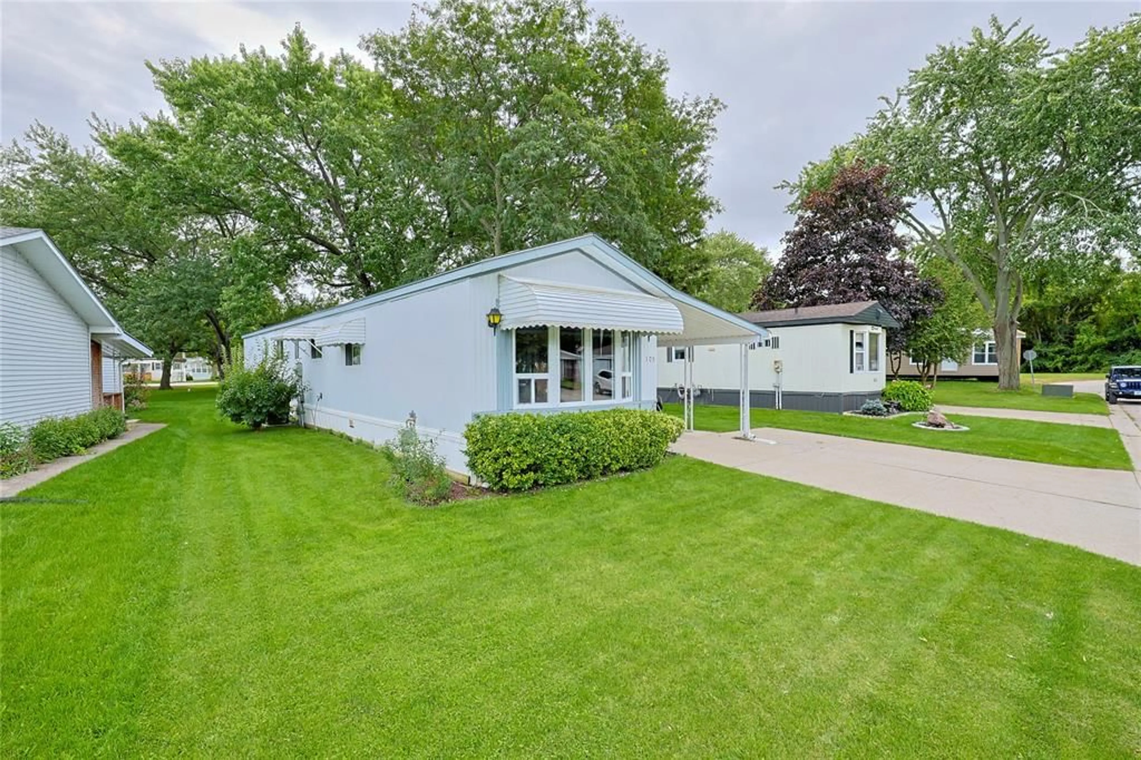Home with vinyl exterior material, street for 1940 London Line #105, Sarnia Ontario N7W 1B5