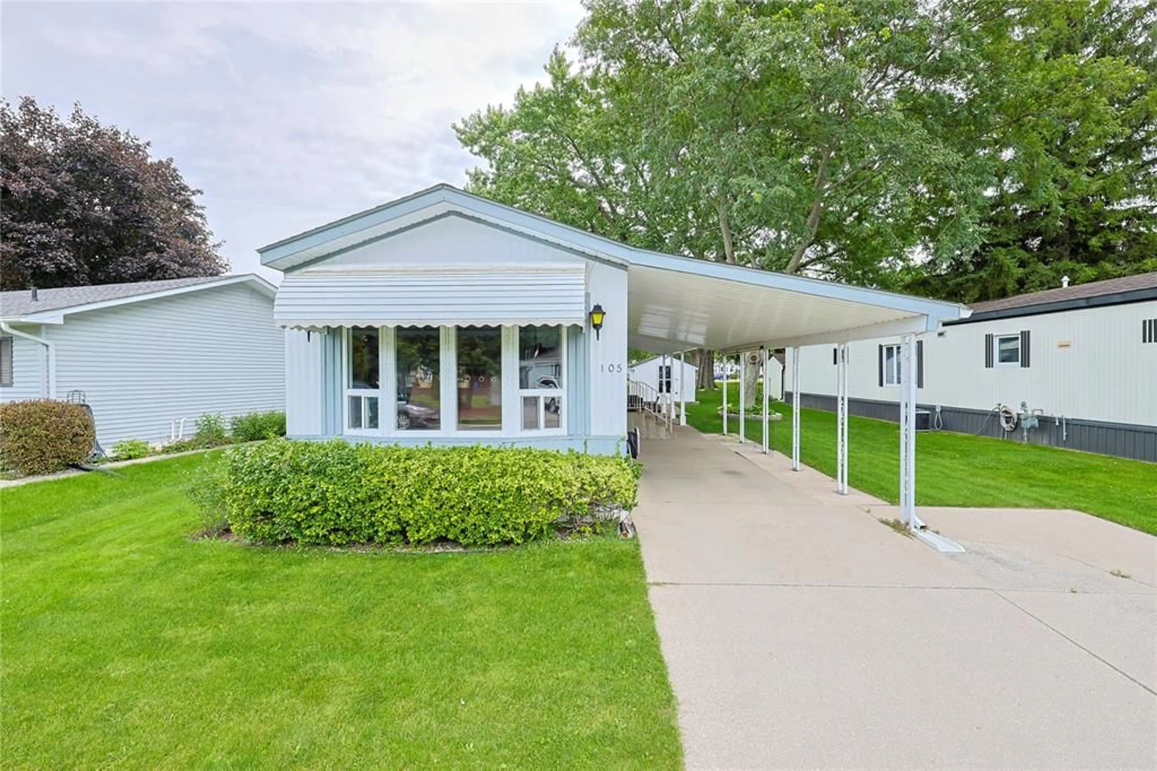 Home with vinyl exterior material, street for 1940 London Line #105, Sarnia Ontario N7W 1B5