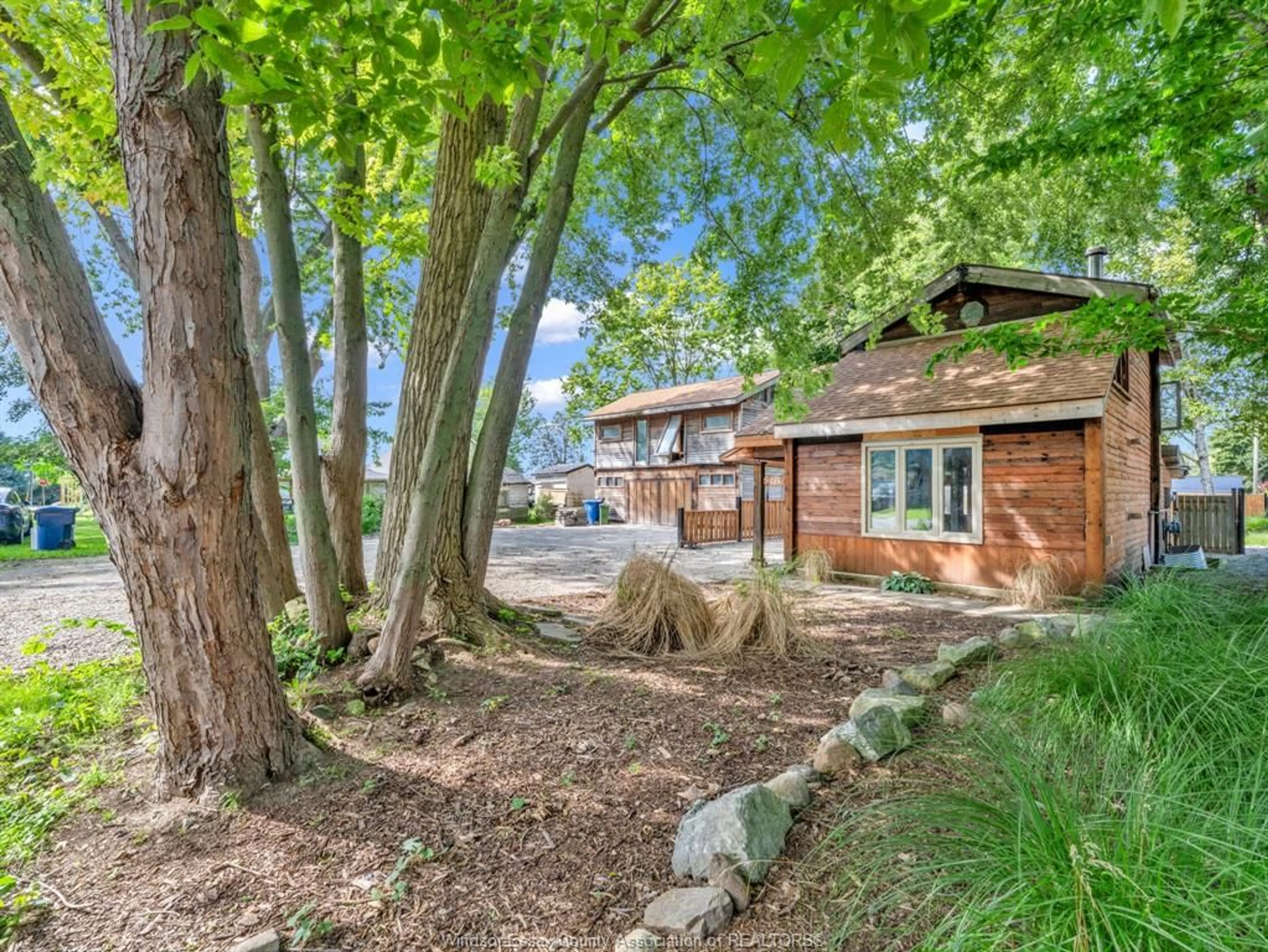 A pic from outside/outdoor area/front of a property/back of a property/a pic from drone, forest/trees view for 145 PRADO Ave, Colchester Ontario N0R 1G0