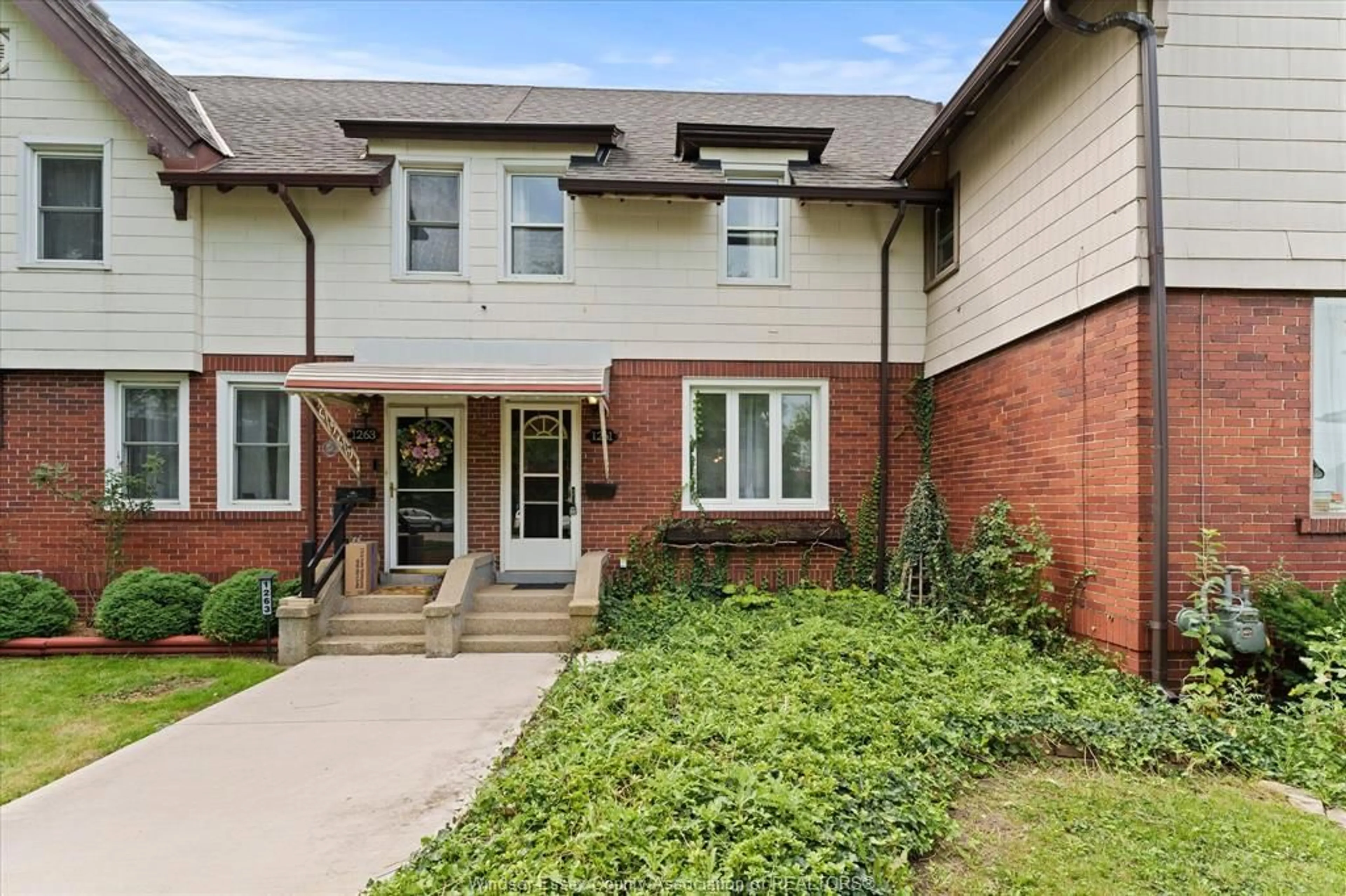 Home with brick exterior material, street for 1261 MONMOUTH Rd, Windsor Ontario N8Y 3M2