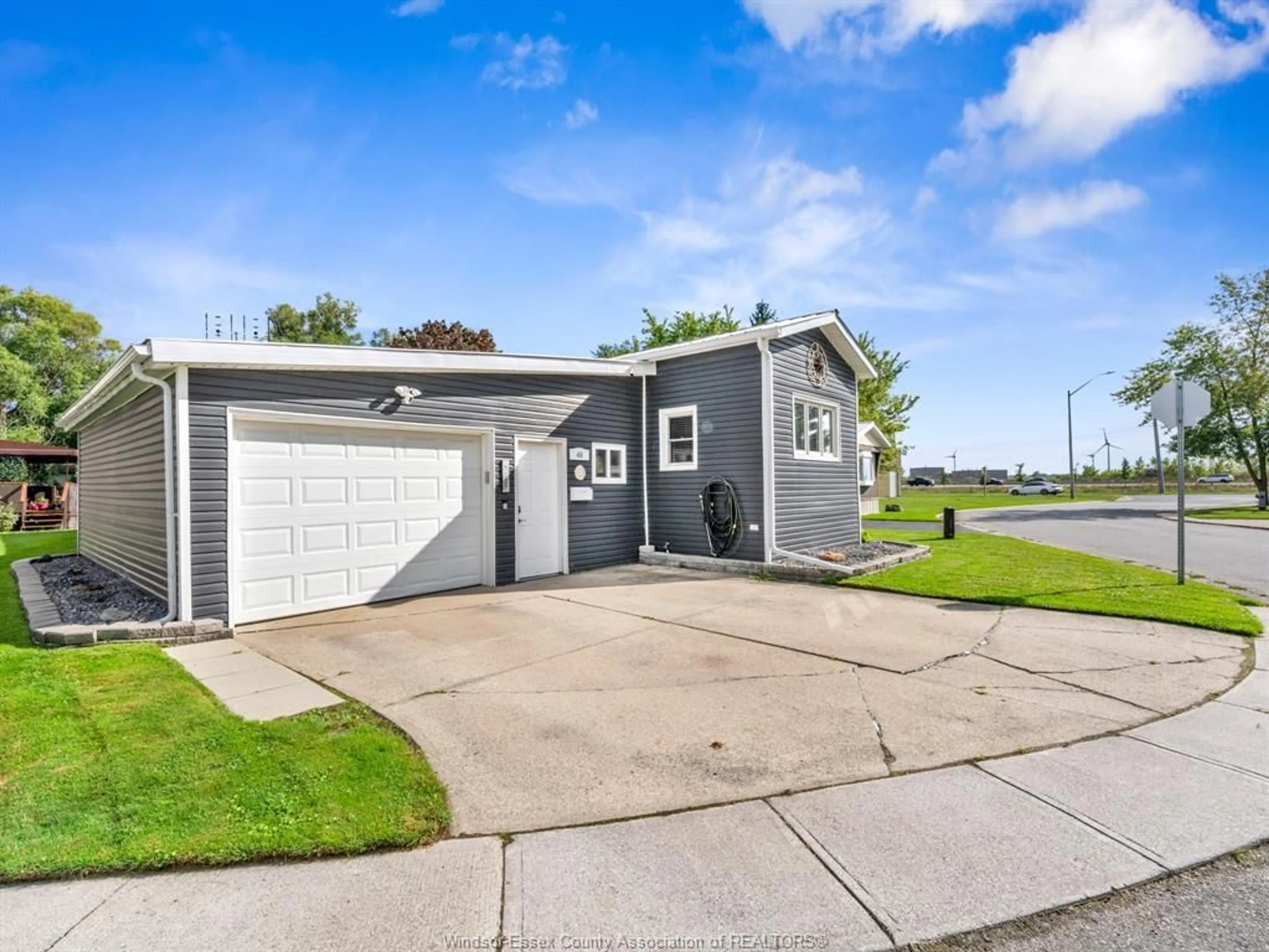 Home with vinyl exterior material, street for 46 DIANE Cres, Essex Ontario N8M 1Z3