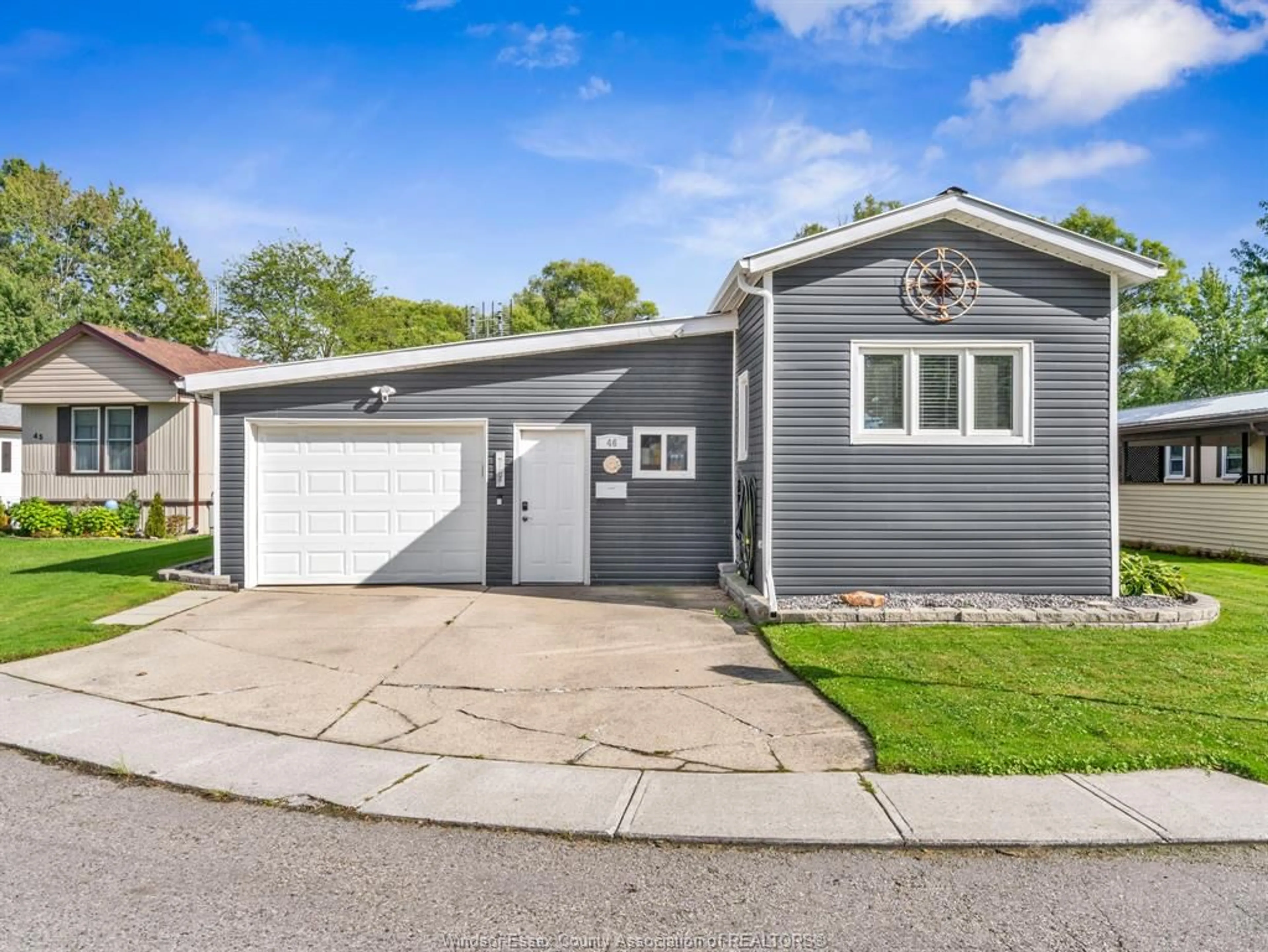 Home with vinyl exterior material, street for 46 DIANE Cres, Essex Ontario N8M 1Z3