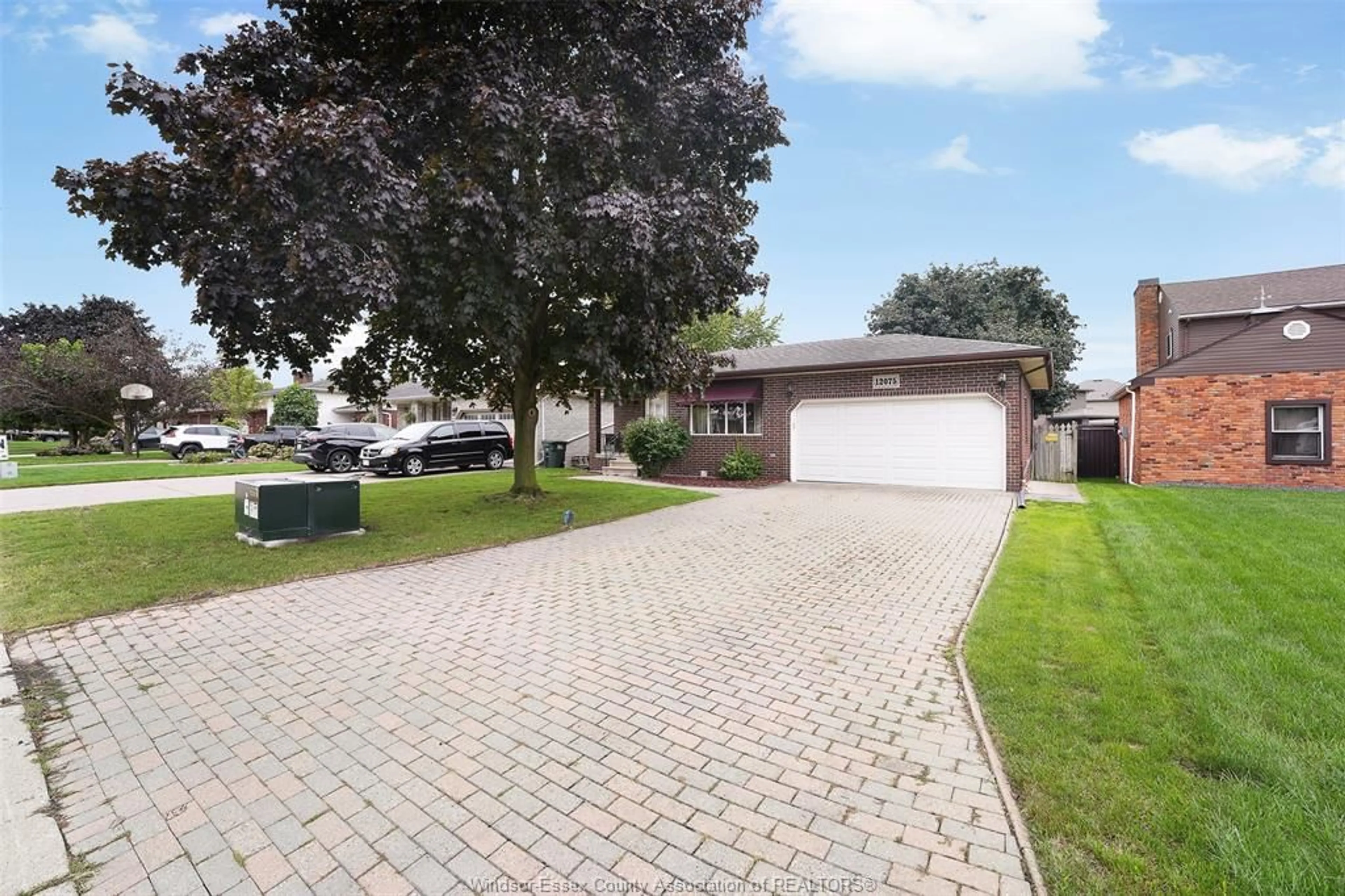 A pic from outside/outdoor area/front of a property/back of a property/a pic from drone, street for 12075 ST. THOMAS Cres, Tecumseh Ontario N8N 3V6