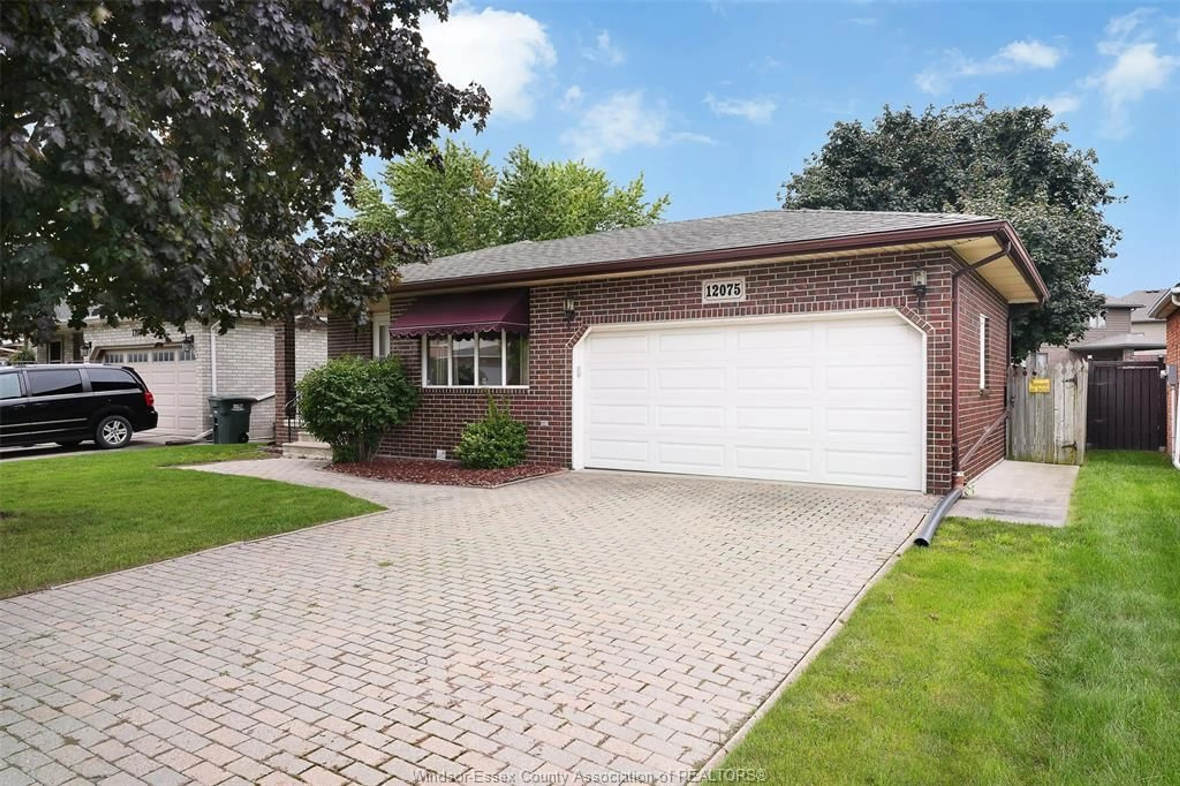 Home with brick exterior material, street for 12075 ST. THOMAS Cres, Tecumseh Ontario N8N 3V6
