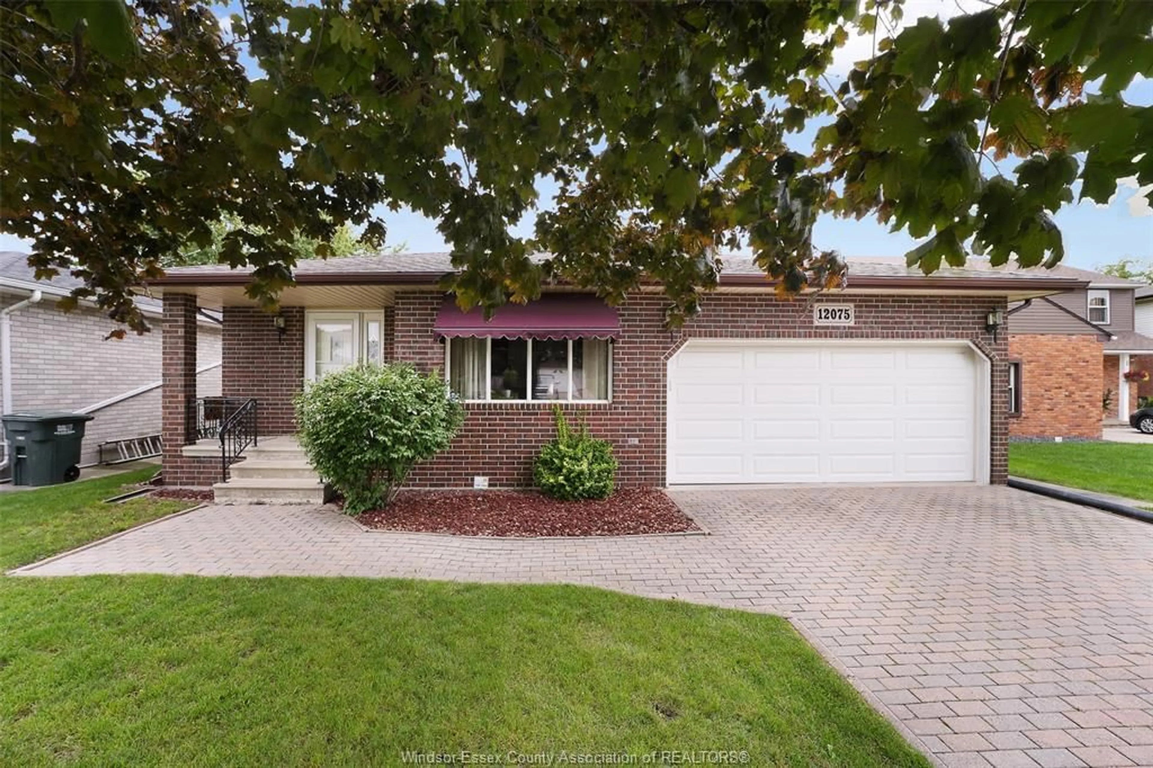 Home with brick exterior material, street for 12075 ST. THOMAS Cres, Tecumseh Ontario N8N 3V6
