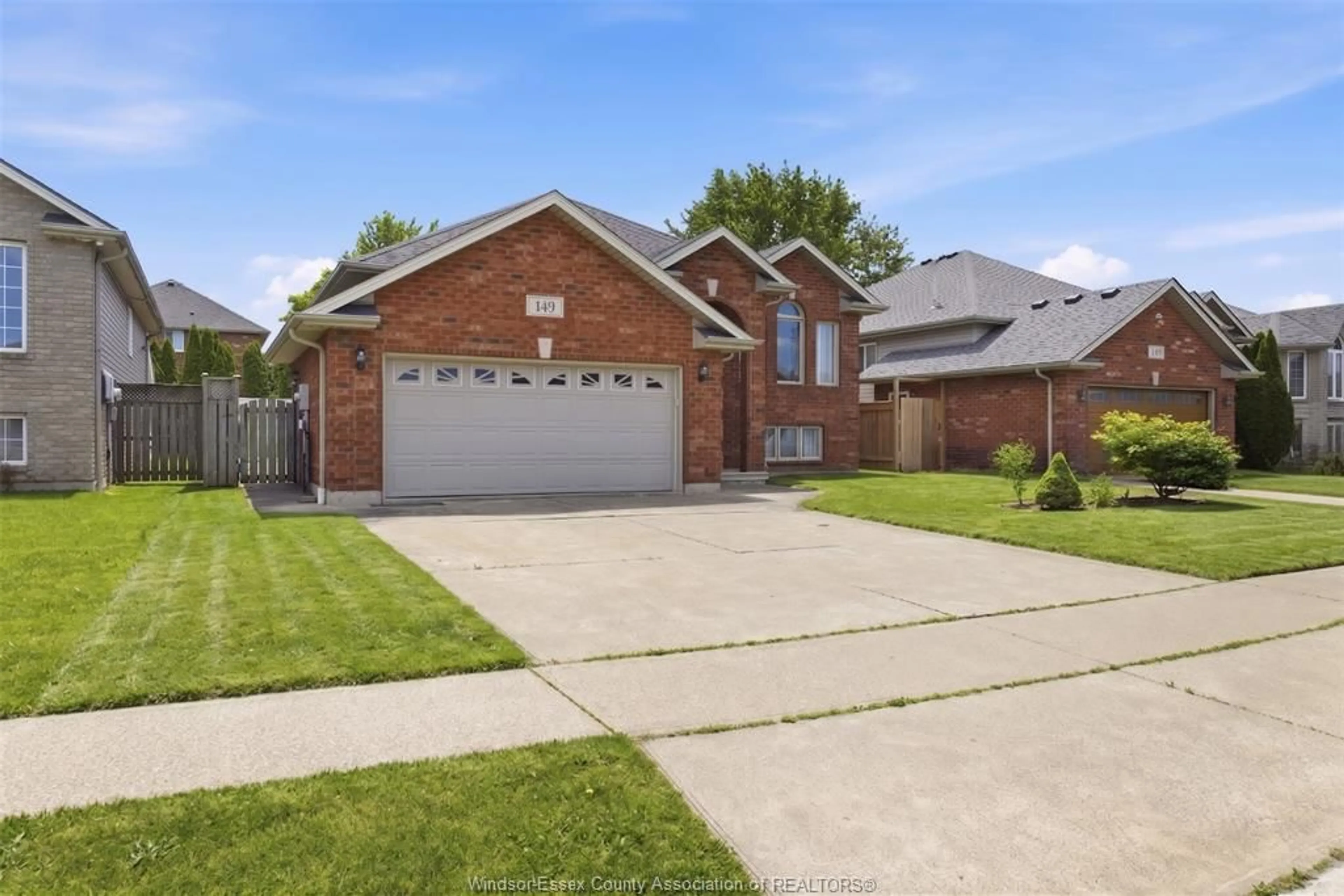 Home with brick exterior material, street for 149 AMY CROFT Dr, Lakeshore Ontario N8K 1E3