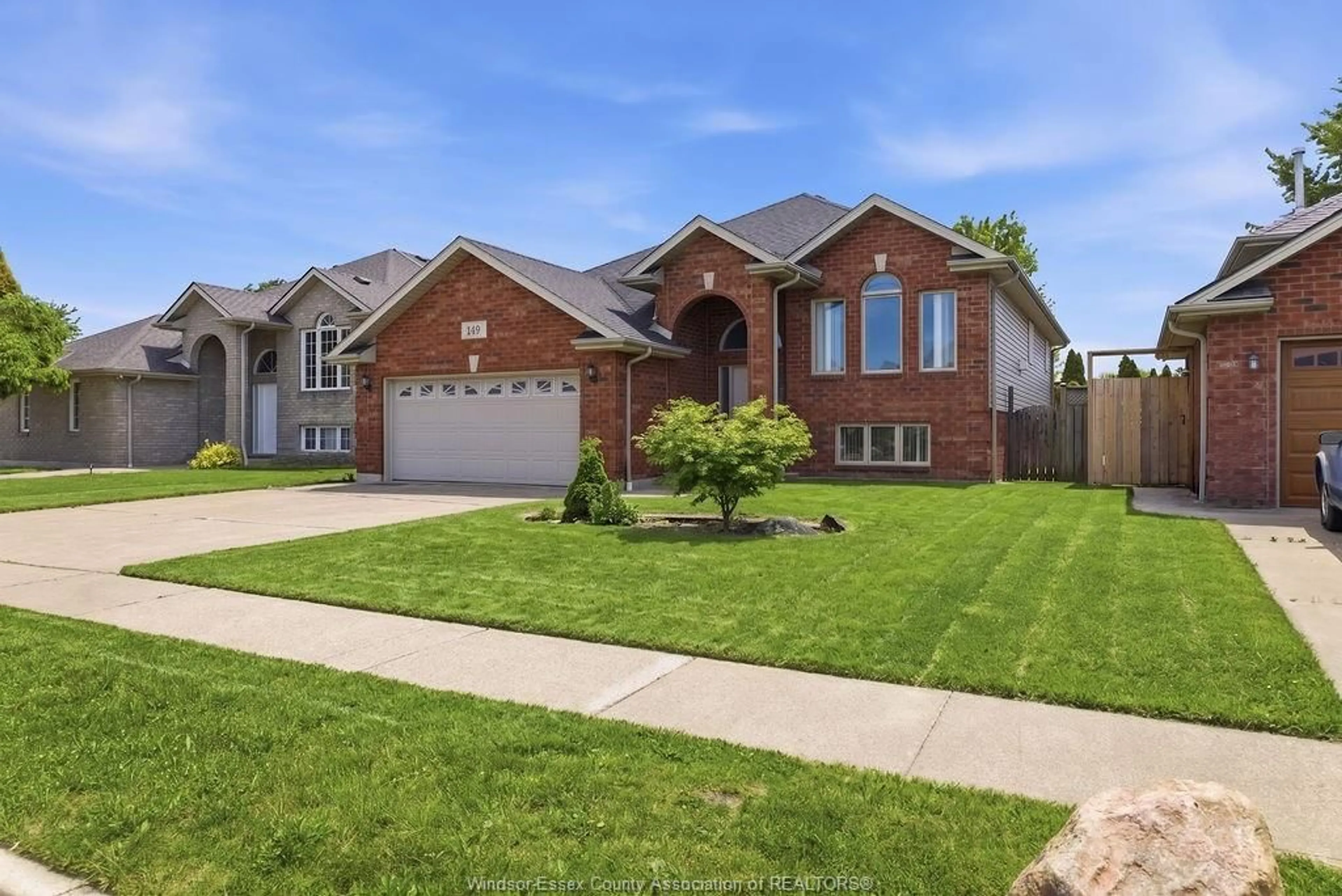 Home with brick exterior material, street for 149 AMY CROFT Dr, Lakeshore Ontario N8K 1E3