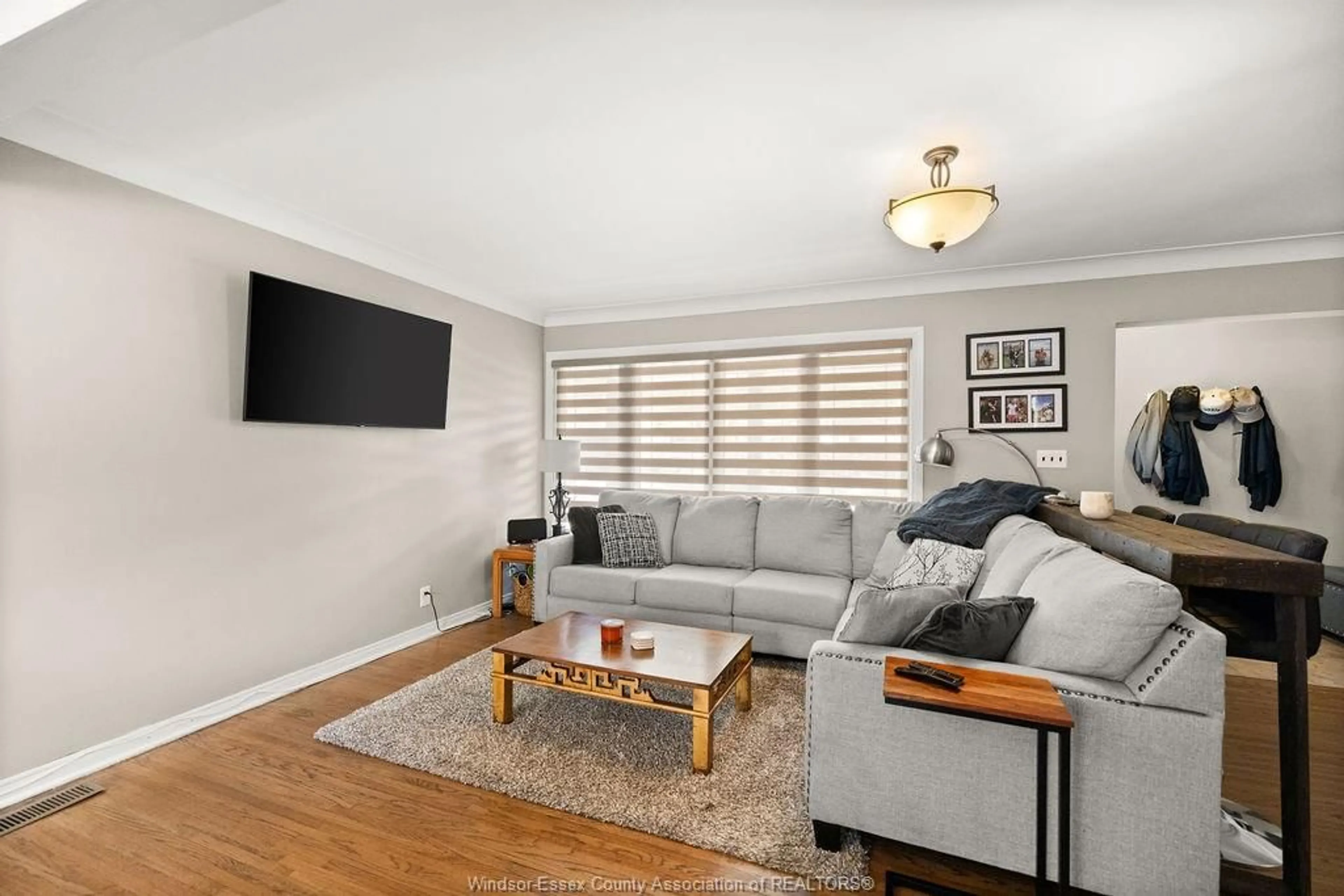 Living room with furniture, wood/laminate floor for 1023 MARJORIE Dr, Windsor Ontario N8S 4A2