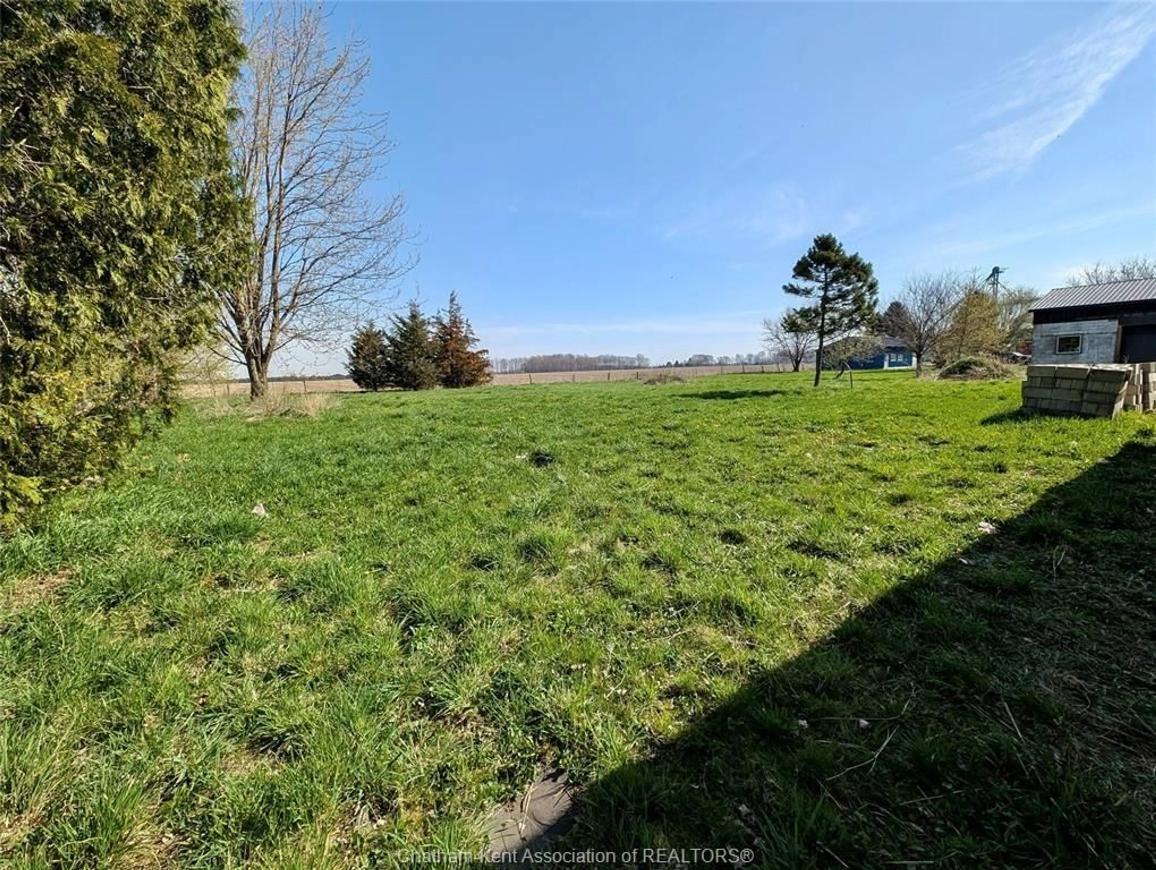 A pic from outside/outdoor area/front of a property/back of a property/a pic from drone, forest/trees view for 12003 Base Line Rd, Thamesville Ontario N0P 2K0