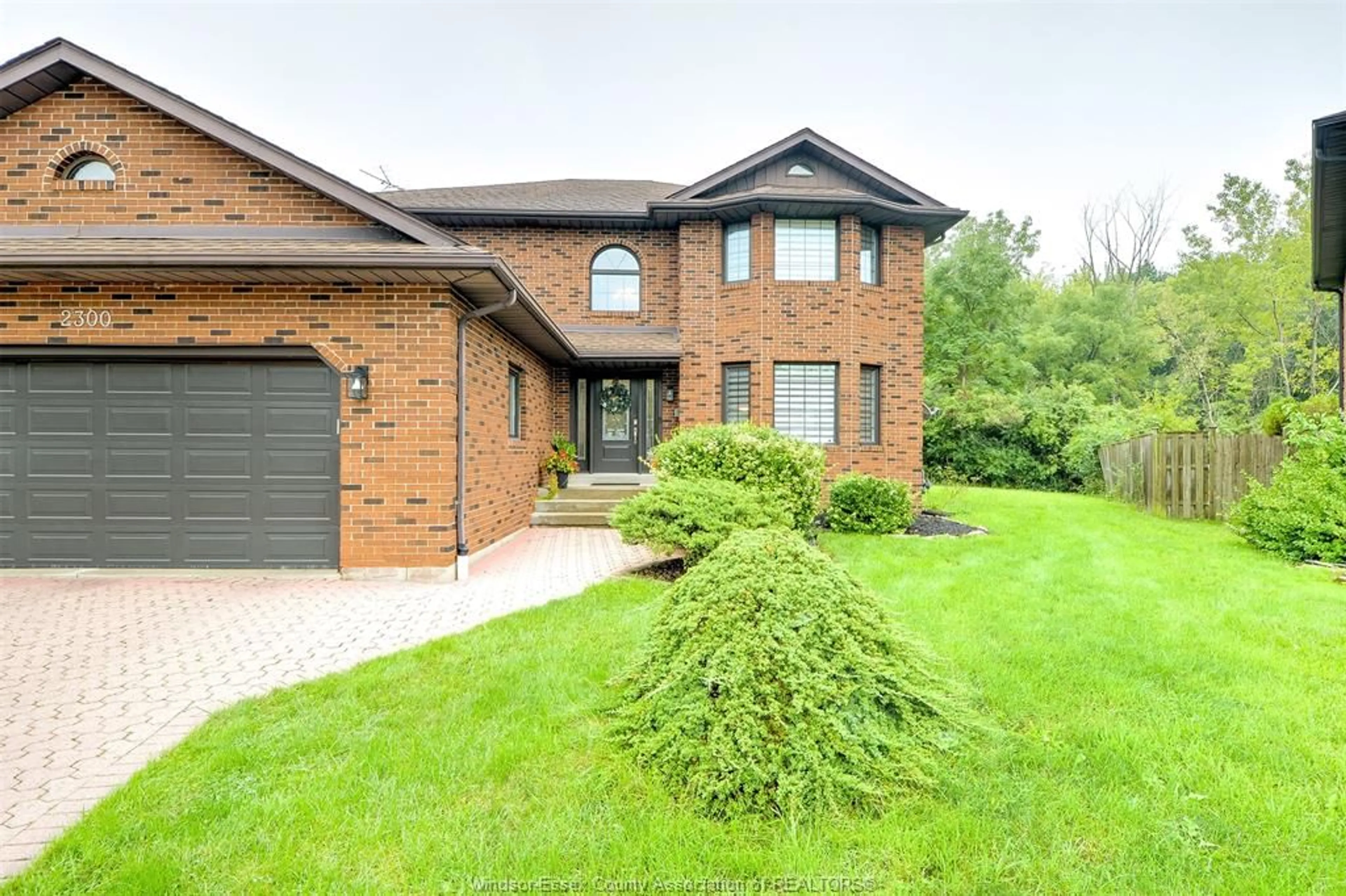 Home with brick exterior material, street for 2300 Santo Dr, Windsor Ontario N9G 2J8