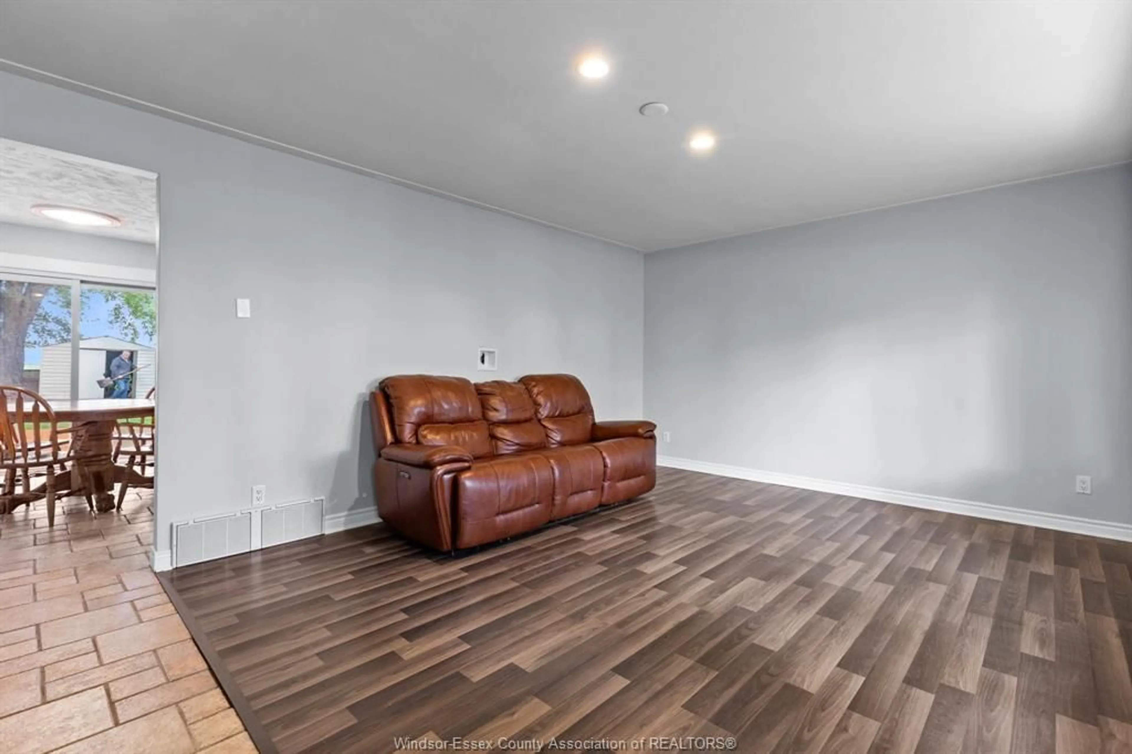 Living room with furniture, wood/laminate floor for 851 County Rd 31, St. Joachim Ontario N8L 1L7