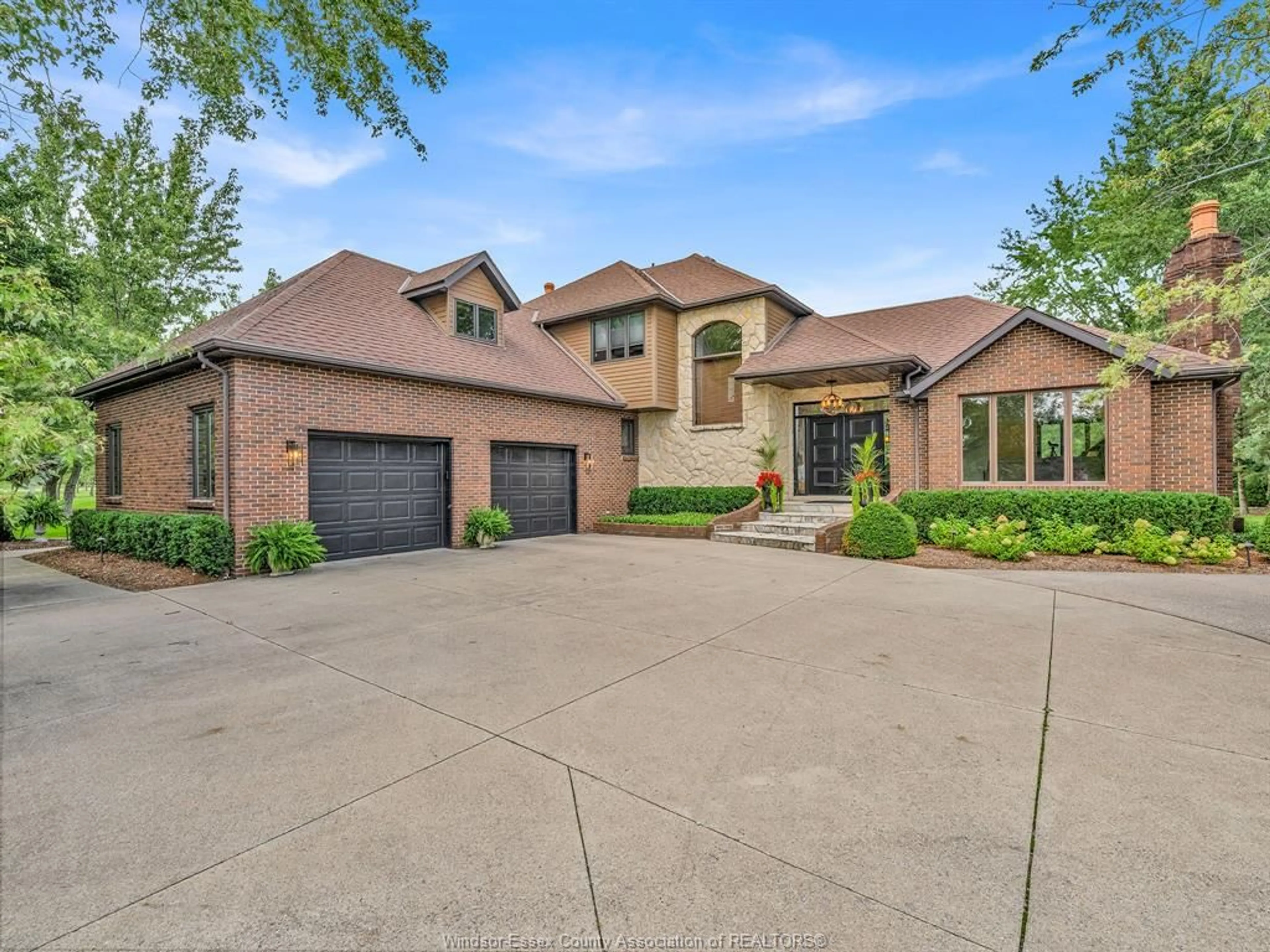 Home with brick exterior material, street for 4024 HICKORY ACRES Dr, Harrow Ontario N0R 1G0