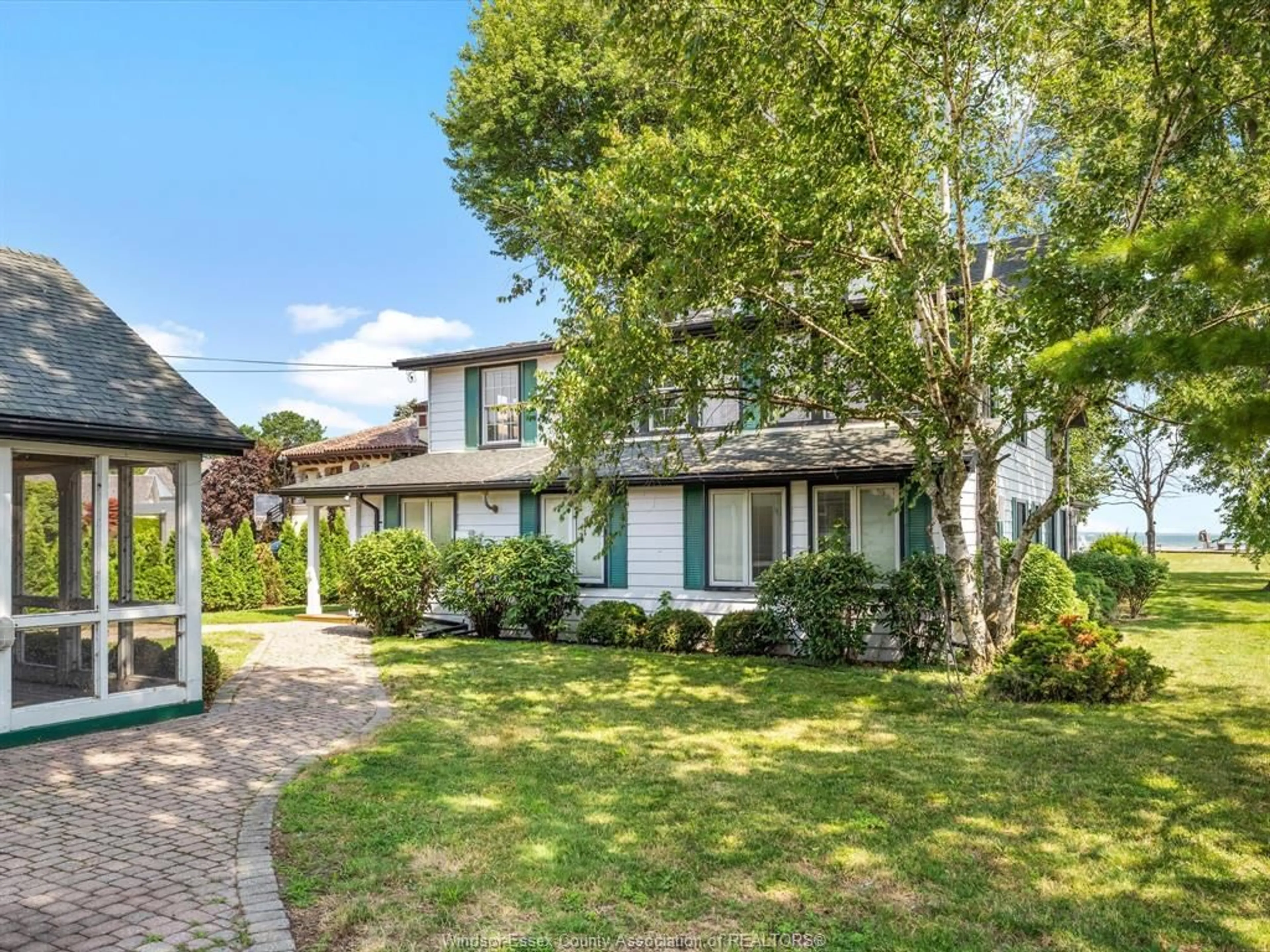 A pic from outside/outdoor area/front of a property/back of a property/a pic from drone, street for 13050 RIVERSIDE Dr, Tecumseh Ontario N8N 1A8