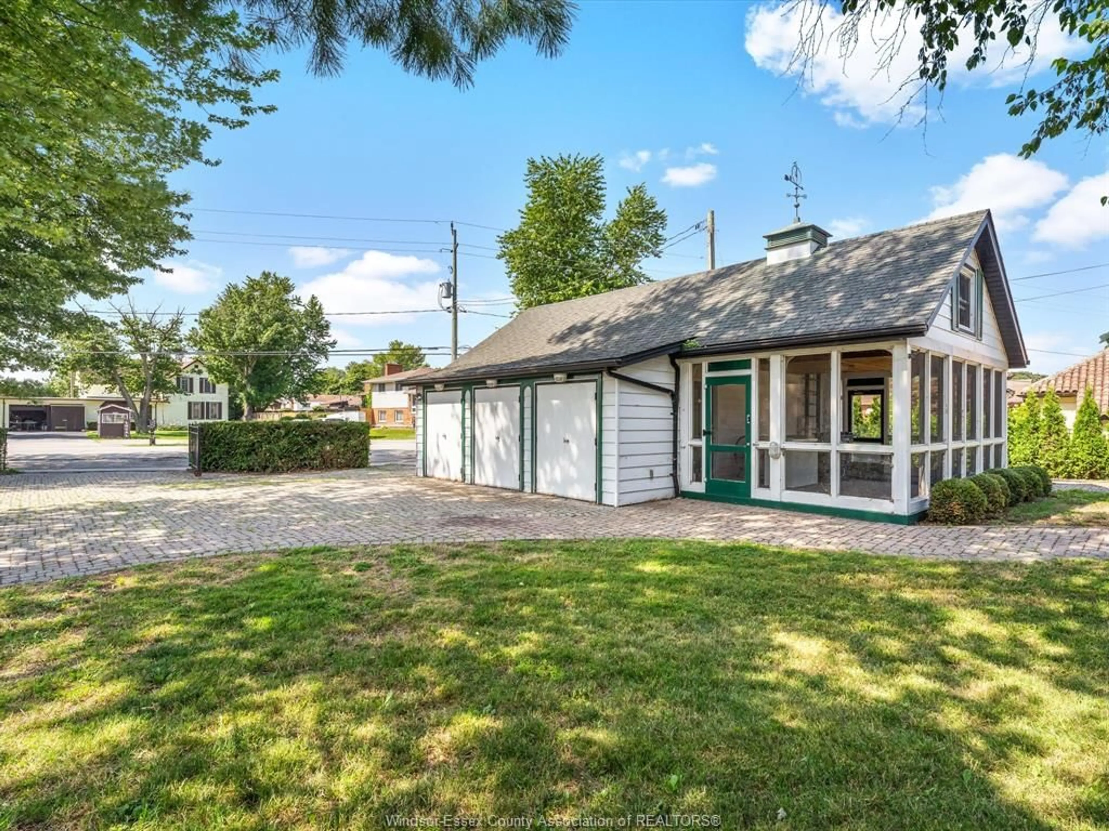 A pic from outside/outdoor area/front of a property/back of a property/a pic from drone, street for 13050 RIVERSIDE Dr, Tecumseh Ontario N8N 1A8