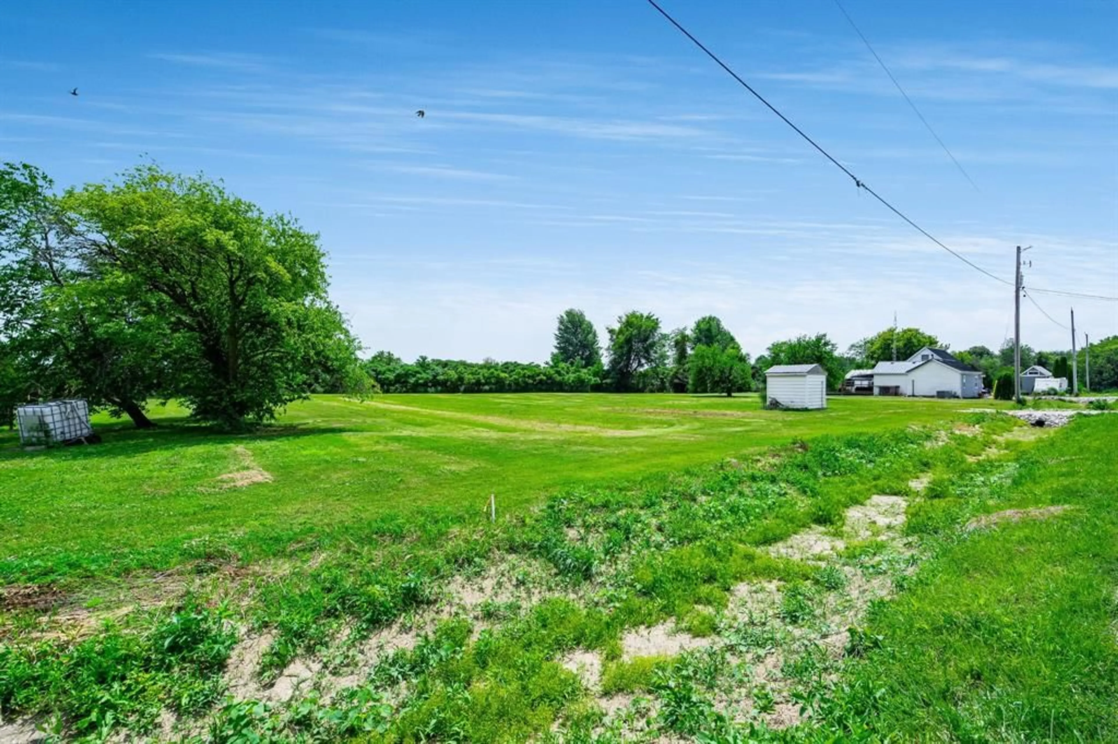 A pic from outside/outdoor area/front of a property/back of a property/a pic from drone, water/lake/river/ocean view for 5590 Sixth Line, Fletcher Ontario N0P 1W0