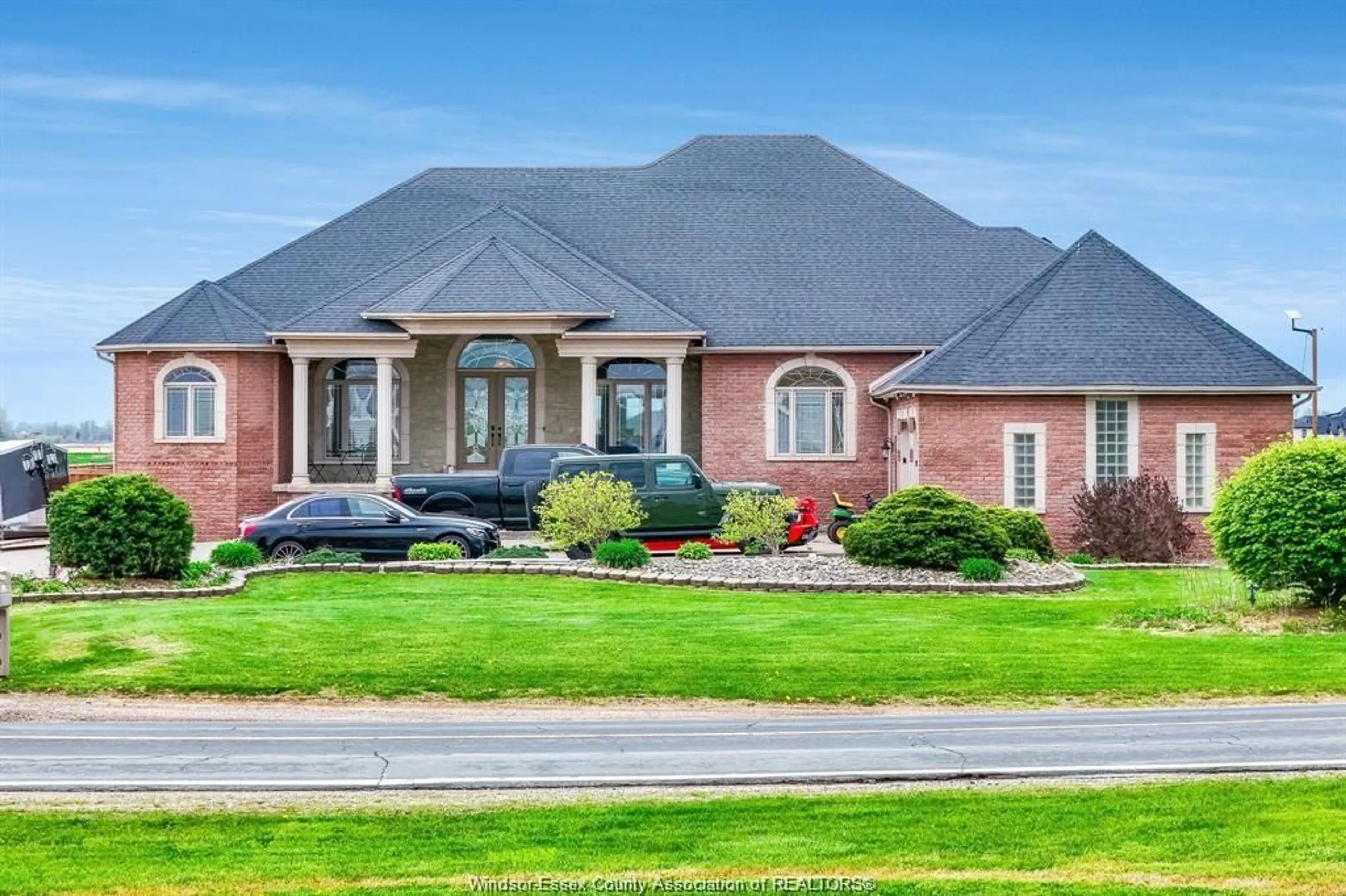Home with brick exterior material, street for 916 MERSEA RD 2, Leamington Ontario N8H 3V7