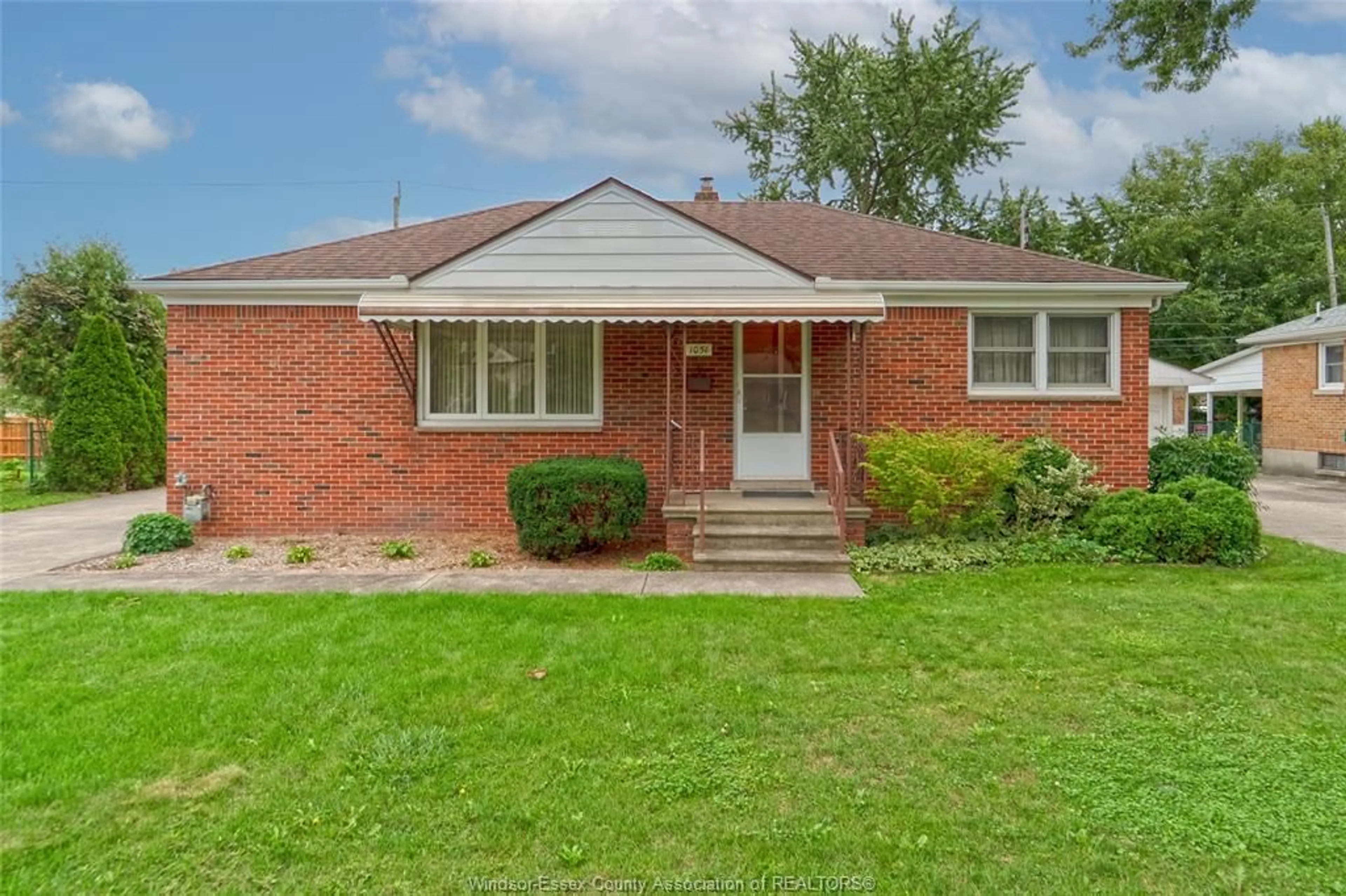 Home with brick exterior material, street for 1051 Grand Marais Rd, Windsor Ontario N9E 1C2
