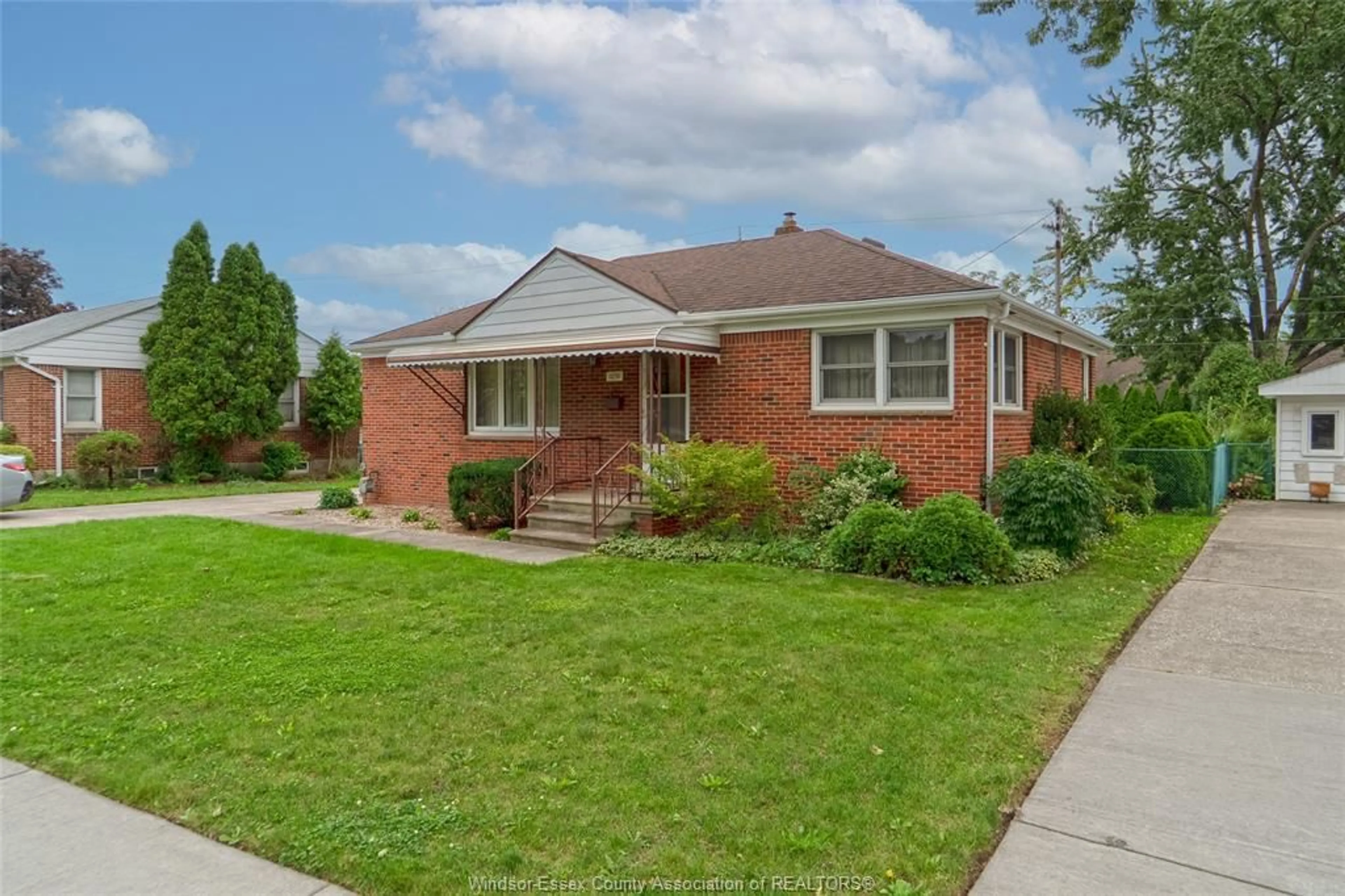 Home with brick exterior material, street for 1051 Grand Marais Rd, Windsor Ontario N9E 1C2