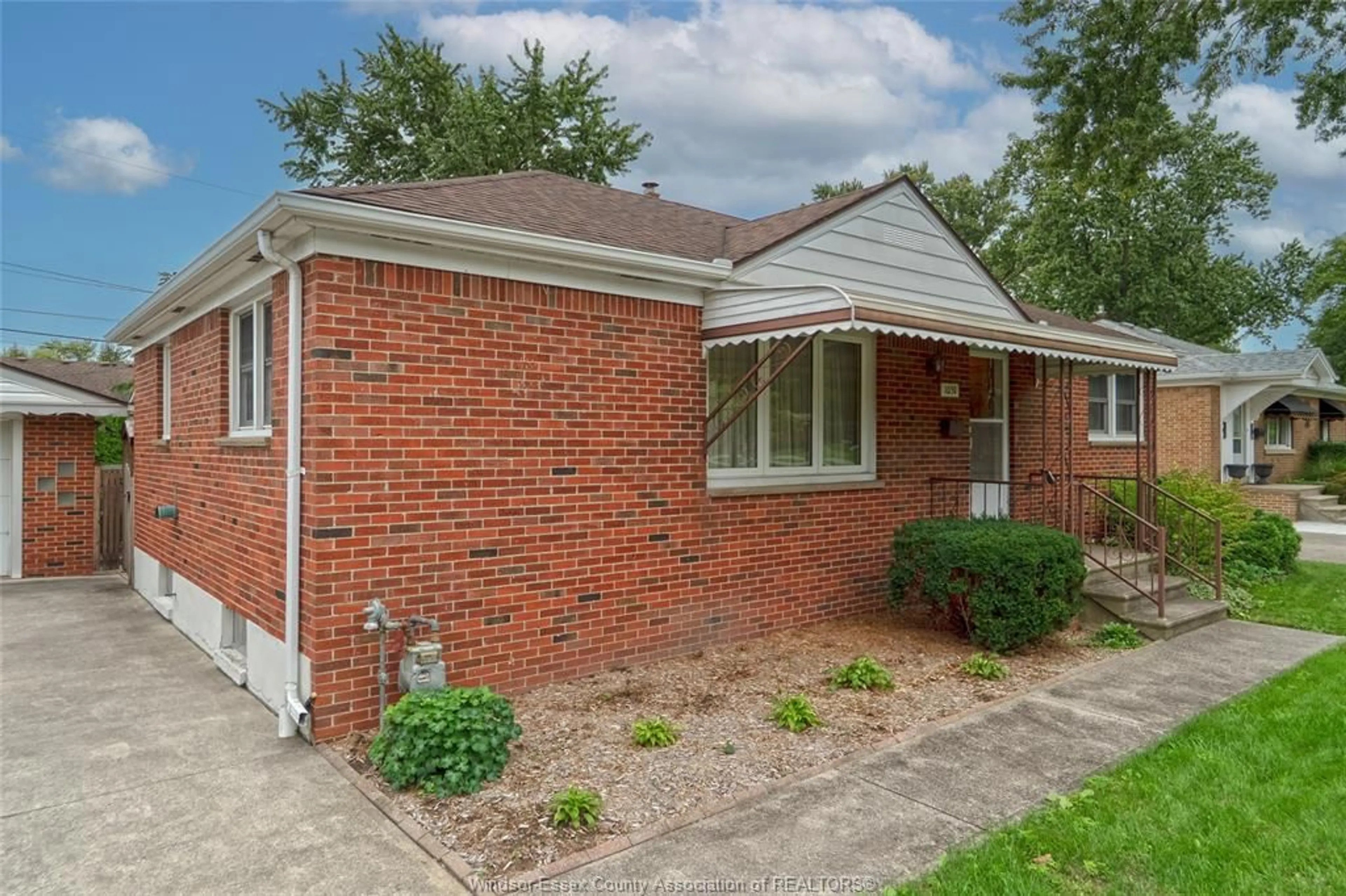 Home with brick exterior material, street for 1051 Grand Marais Rd, Windsor Ontario N9E 1C2