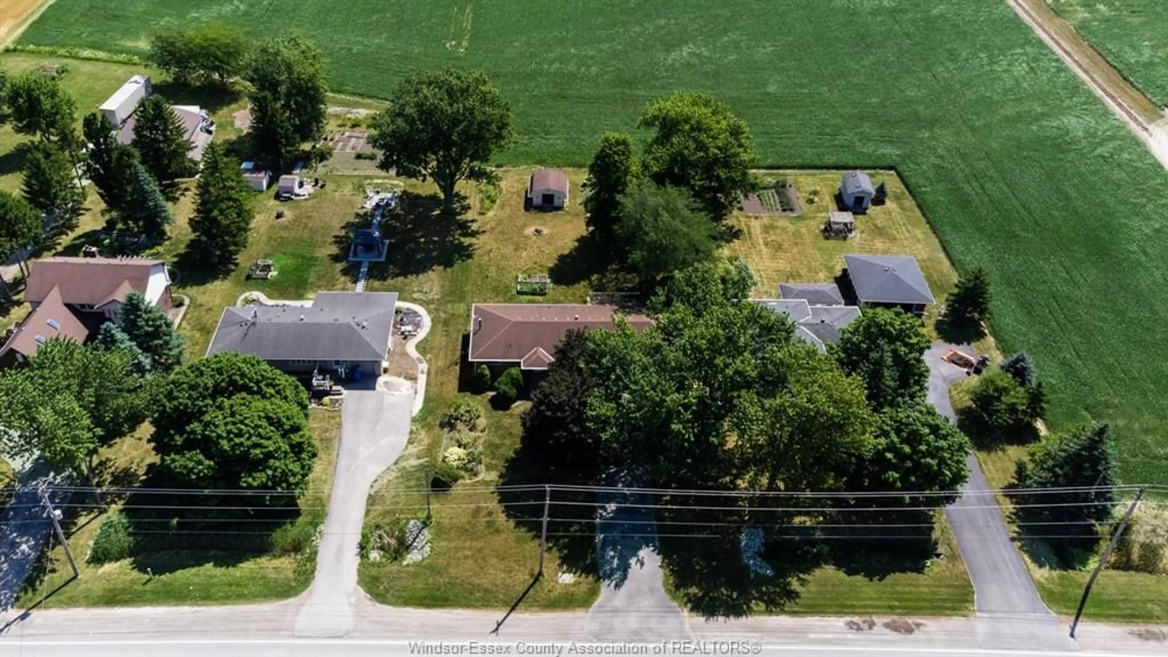 A pic from outside/outdoor area/front of a property/back of a property/a pic from drone, street for 1308 COUNTY RD 27, Lakeshore Ontario N0R 1A0