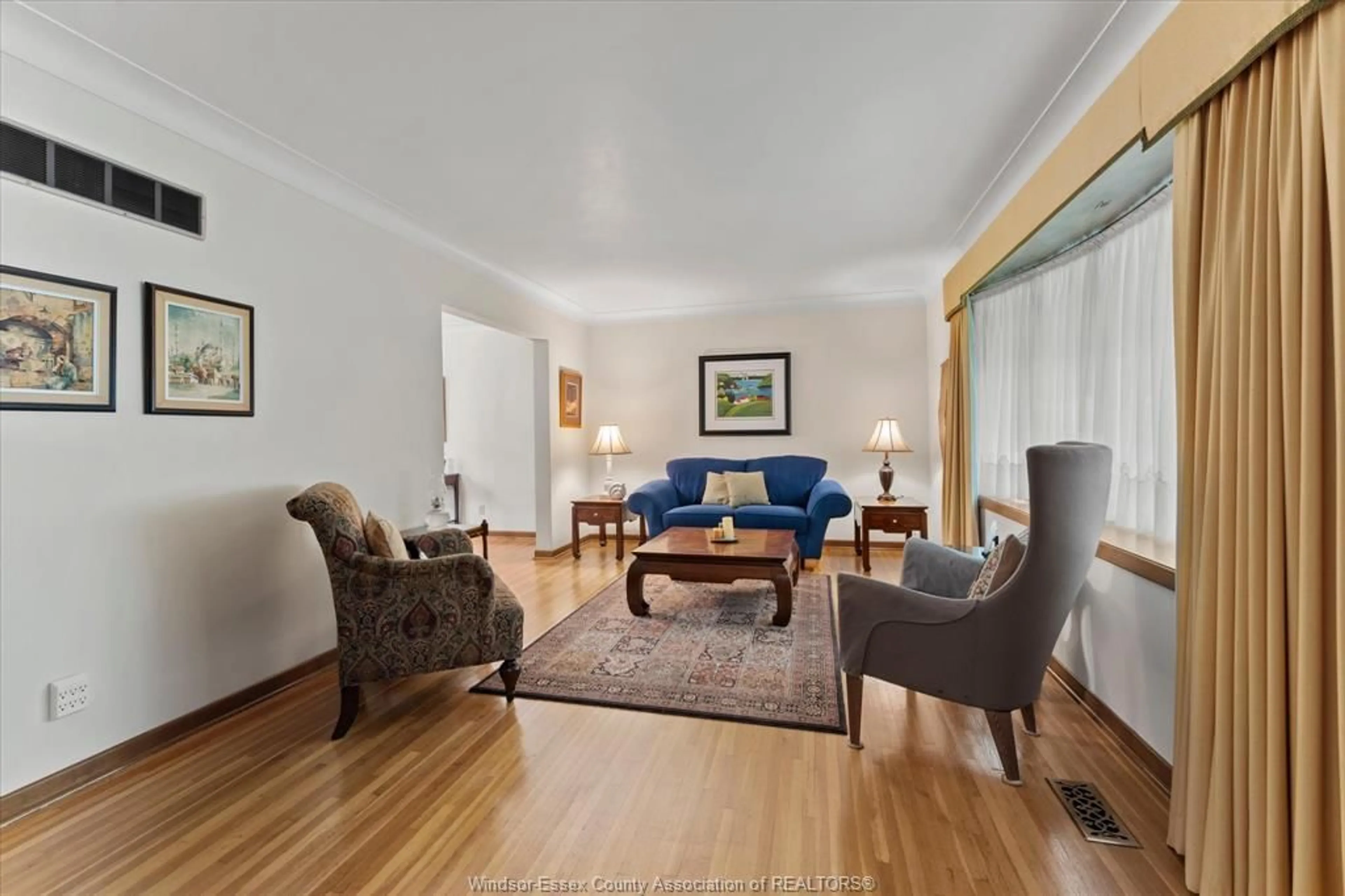 Living room with furniture, wood/laminate floor for 3630 AVONDALE Ave, Windsor Ontario N9E 1X9