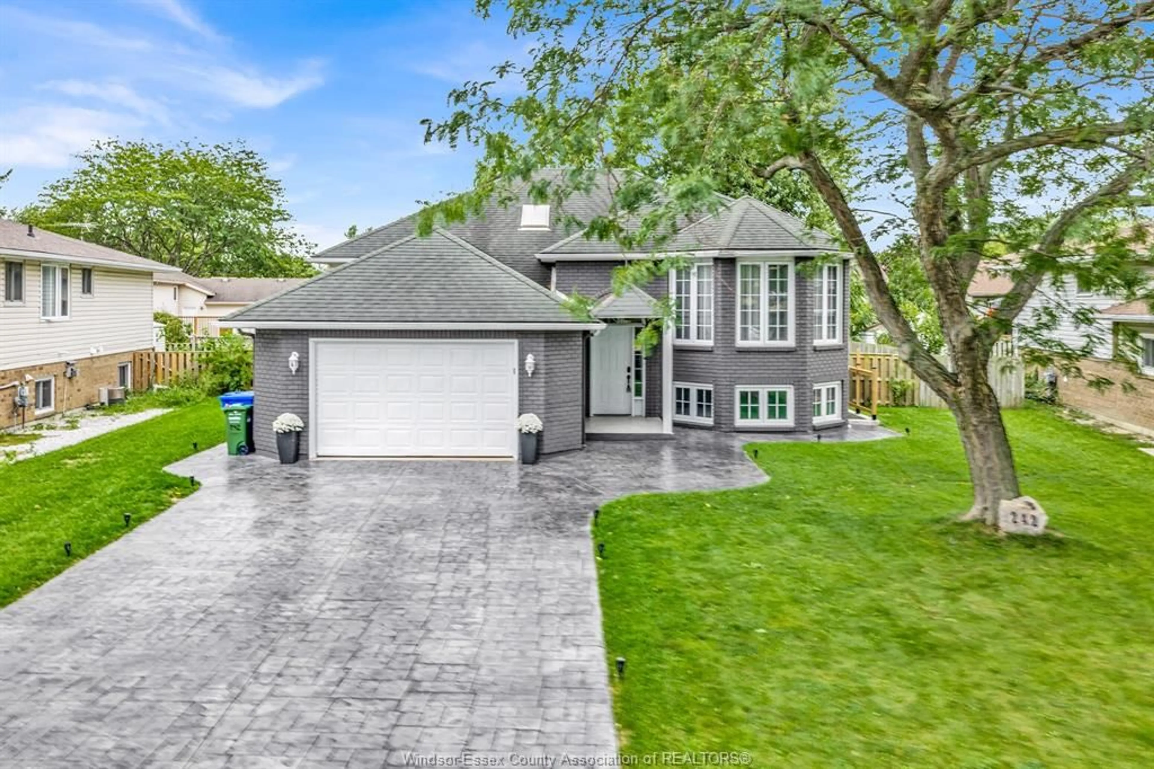 Home with vinyl exterior material, street for 242 GEORGE Cres, Lakeshore Ontario N0R 1A0