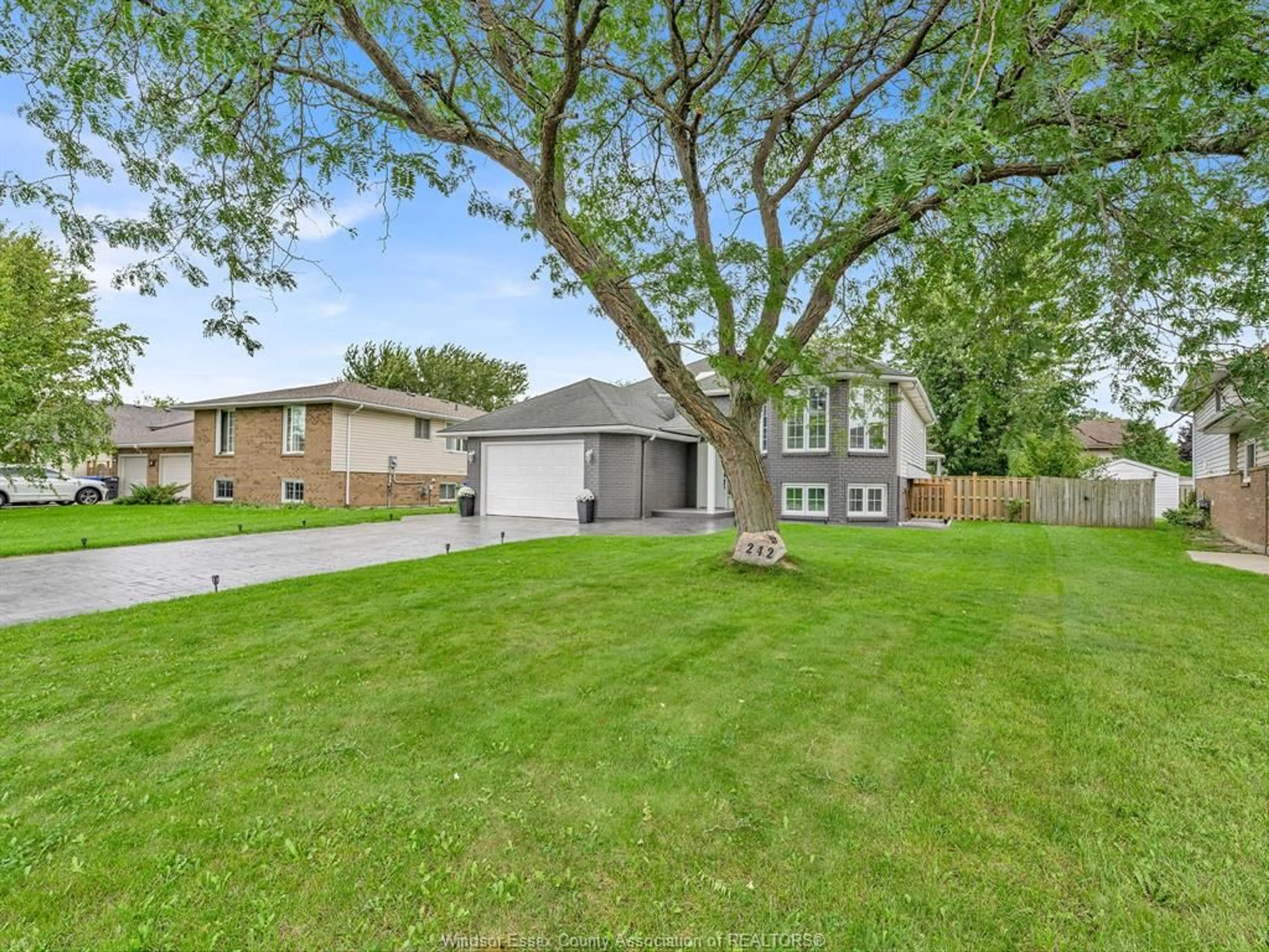 A pic from outside/outdoor area/front of a property/back of a property/a pic from drone, street for 242 GEORGE Cres, Lakeshore Ontario N0R 1A0