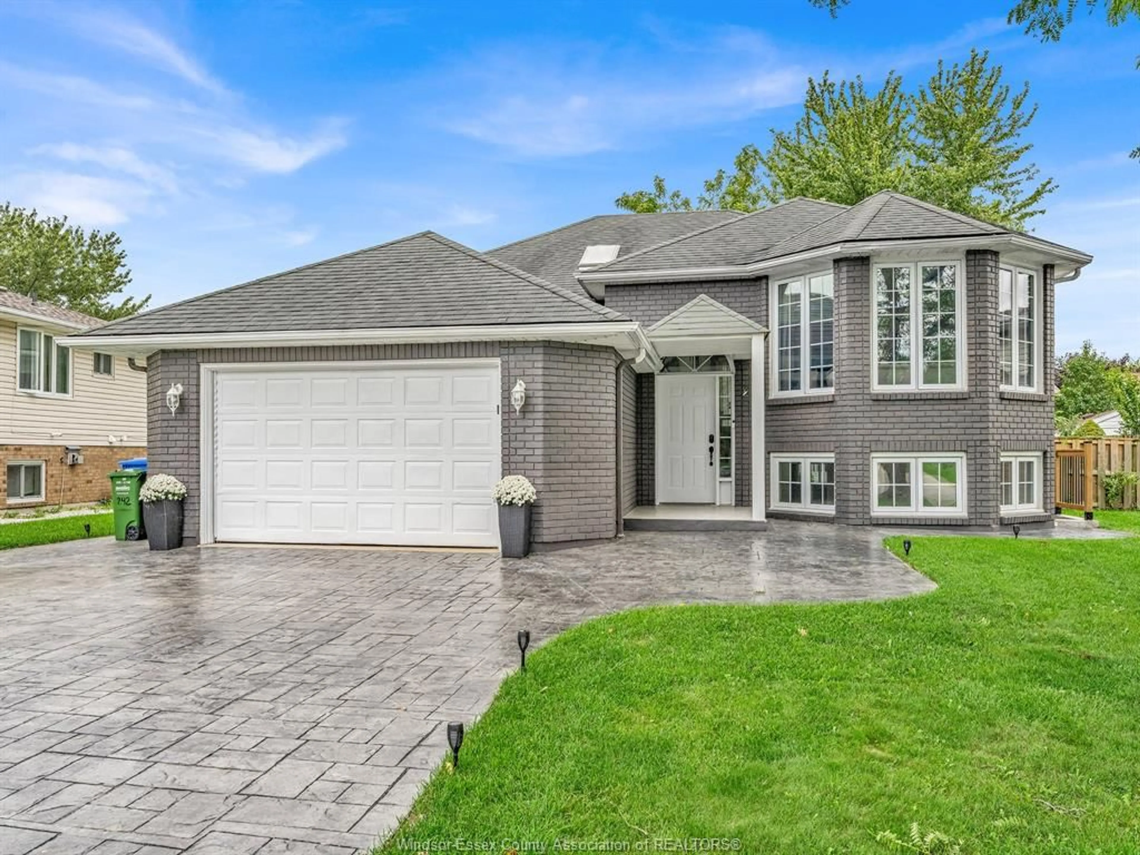 Home with brick exterior material, street for 242 GEORGE Cres, Lakeshore Ontario N0R 1A0