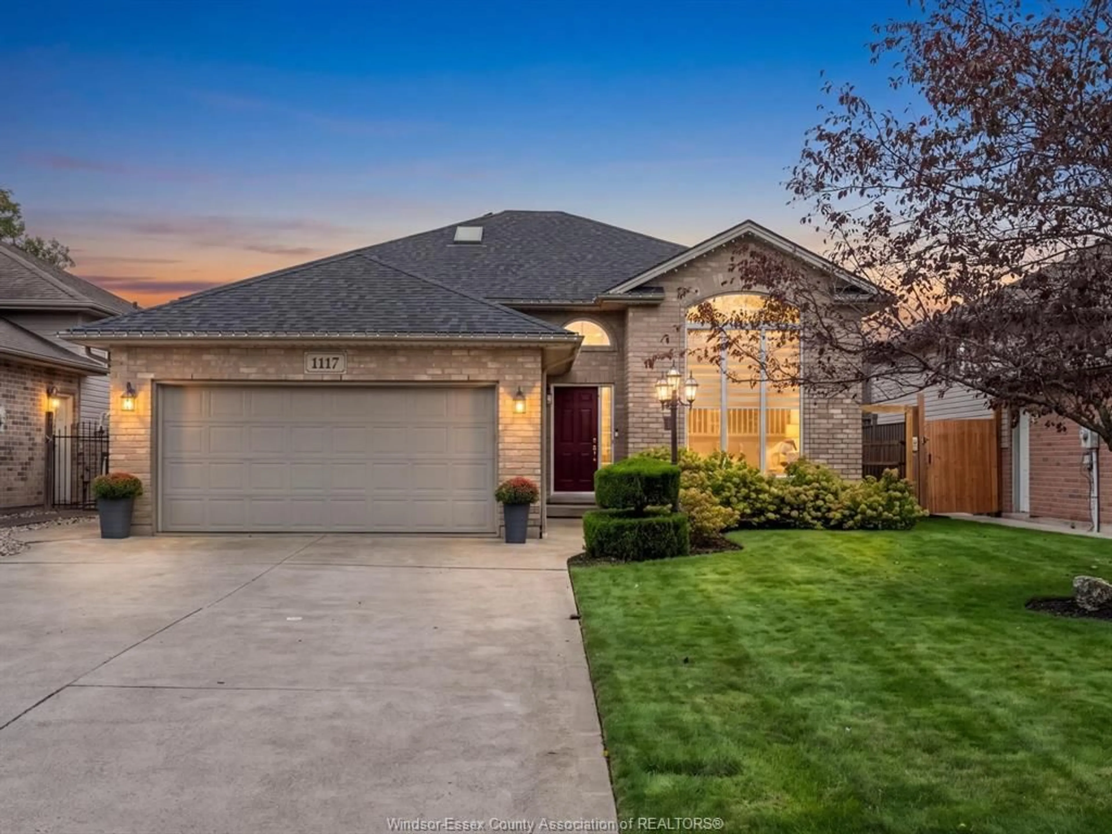 Home with brick exterior material, street for 1117 MONARCH MEADOWS Dr, Lakeshore Ontario N8L 0W5