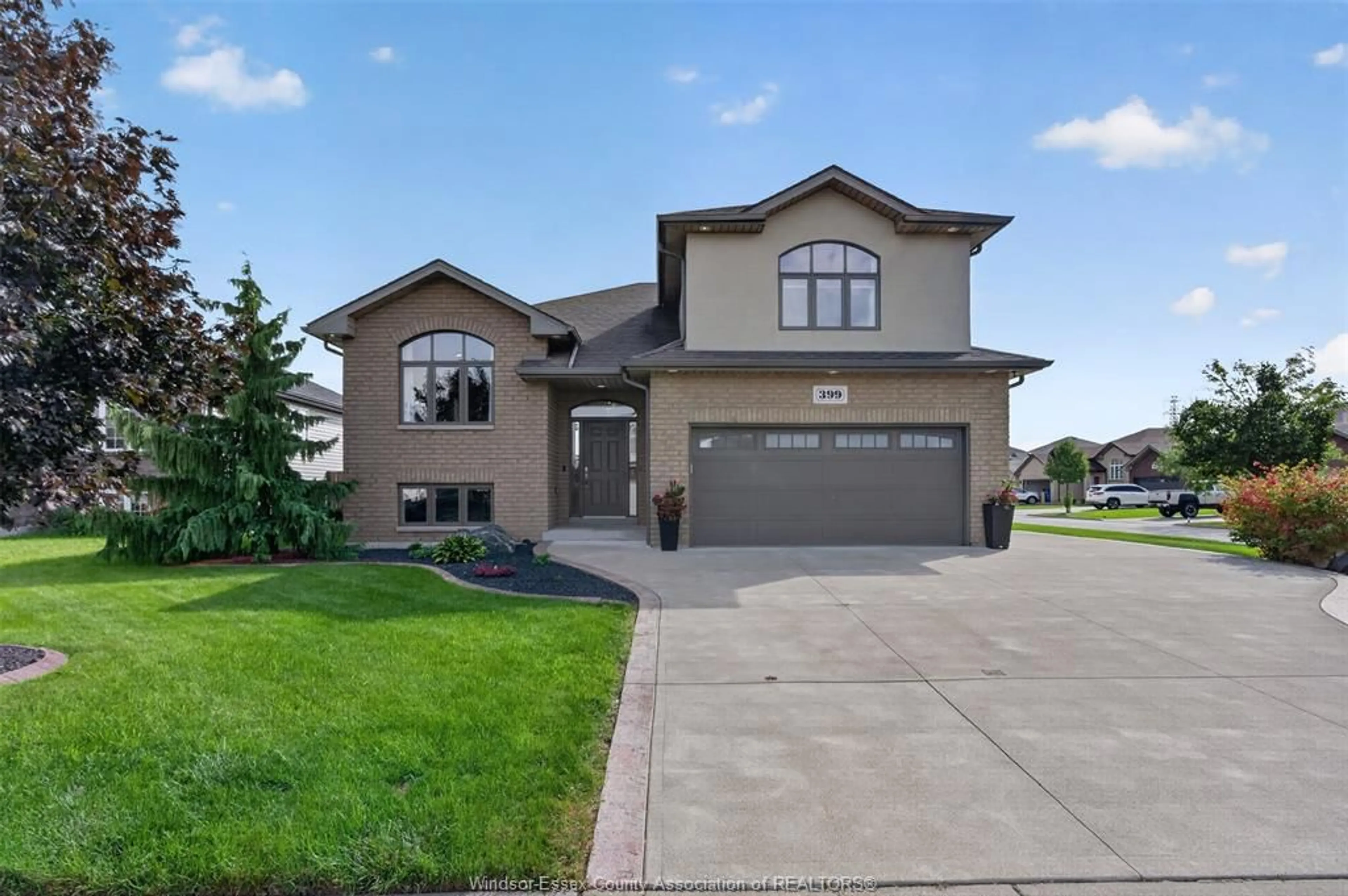 Home with brick exterior material, street for 399 POPLAR Dr, Lakeshore Ontario N8L 0X7