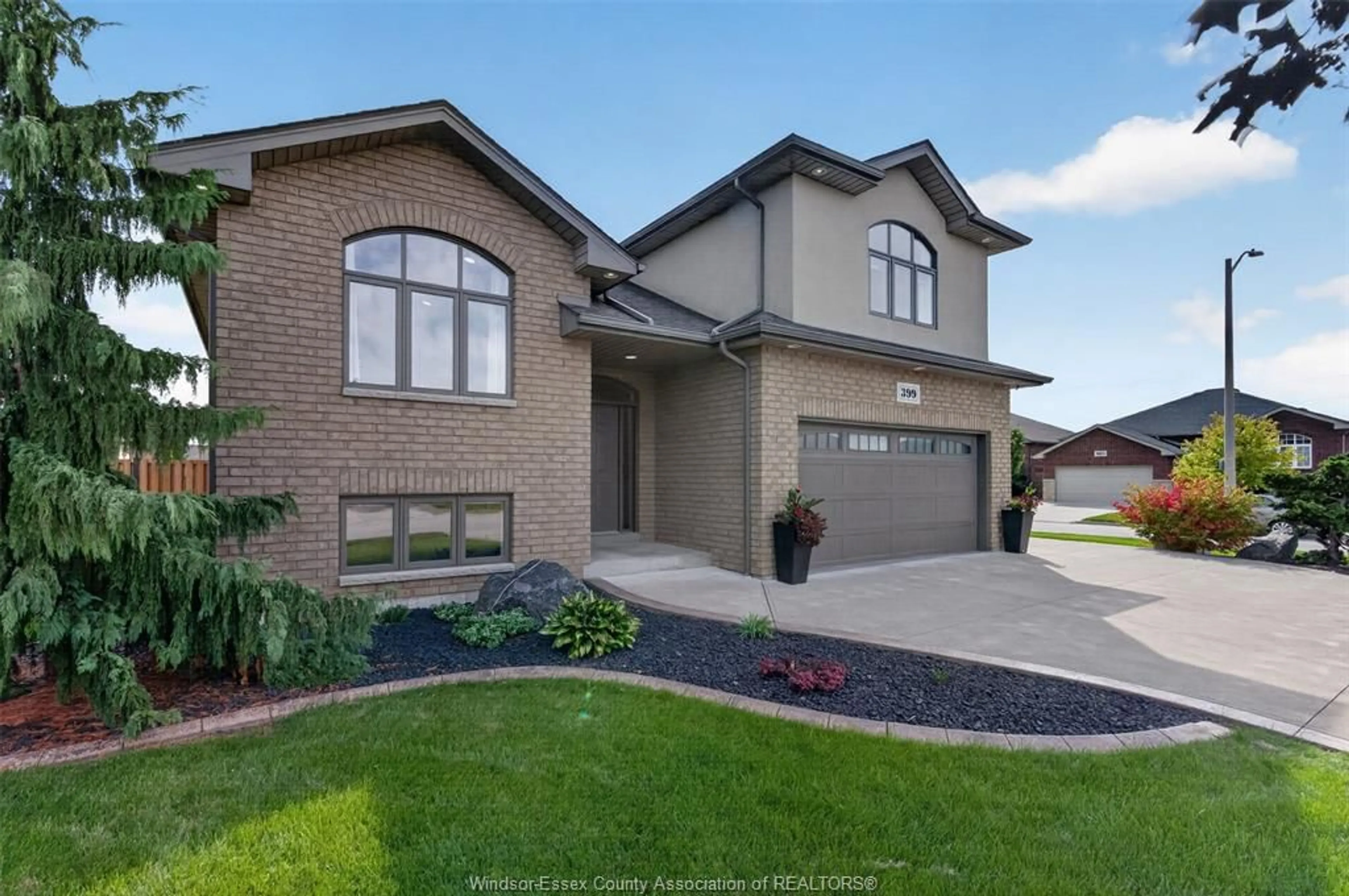 Home with brick exterior material, street for 399 POPLAR Dr, Lakeshore Ontario N8L 0X7