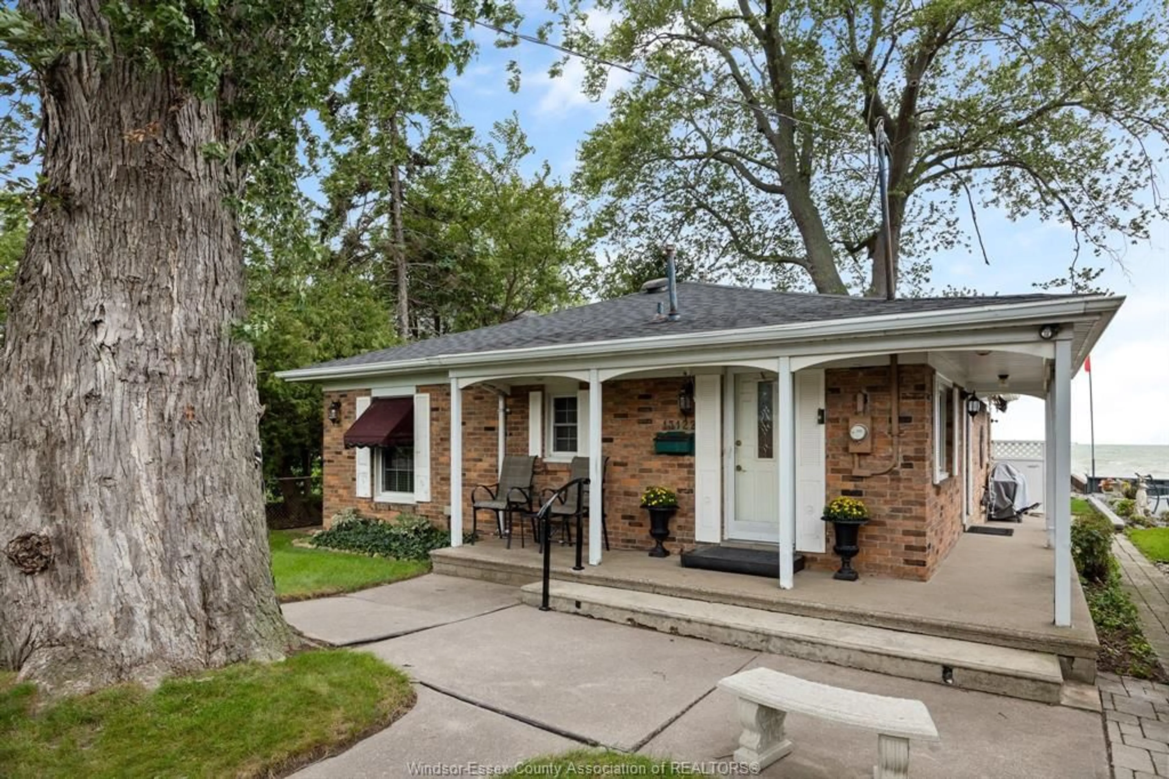 Home with brick exterior material, street for 13122 Riverside Dr, Tecumseh Ontario N8N 2M7