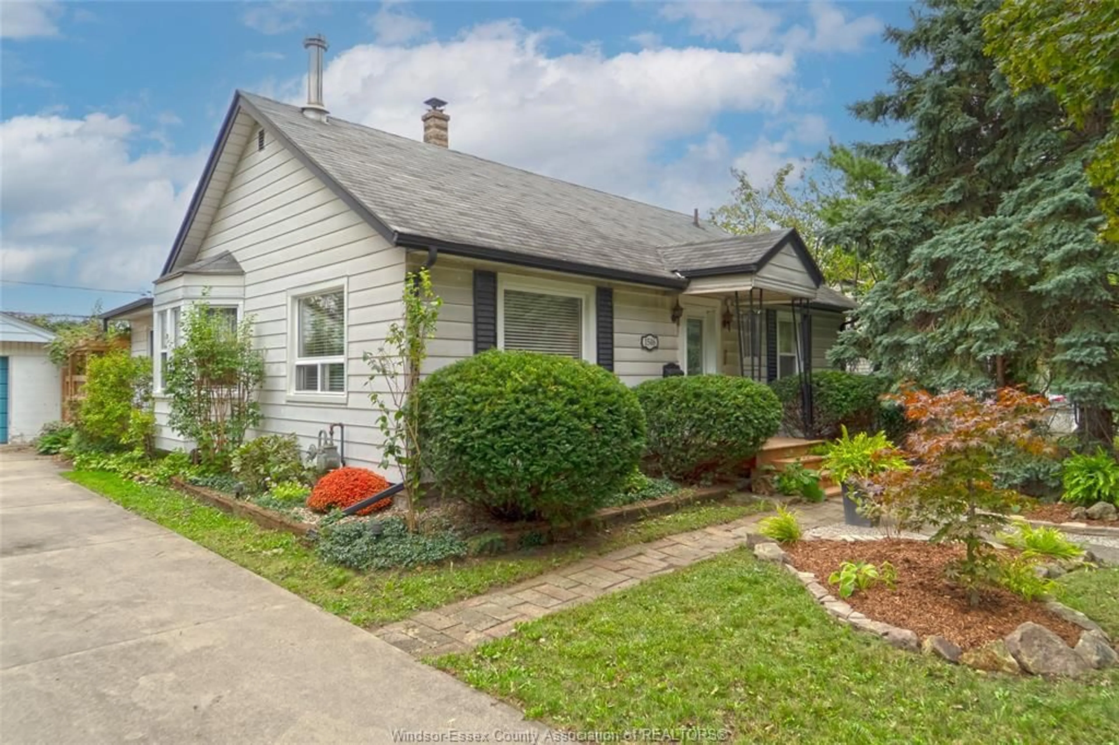 Home with vinyl exterior material, street for 1546 California Ave, Windsor Ontario N9B 3A3
