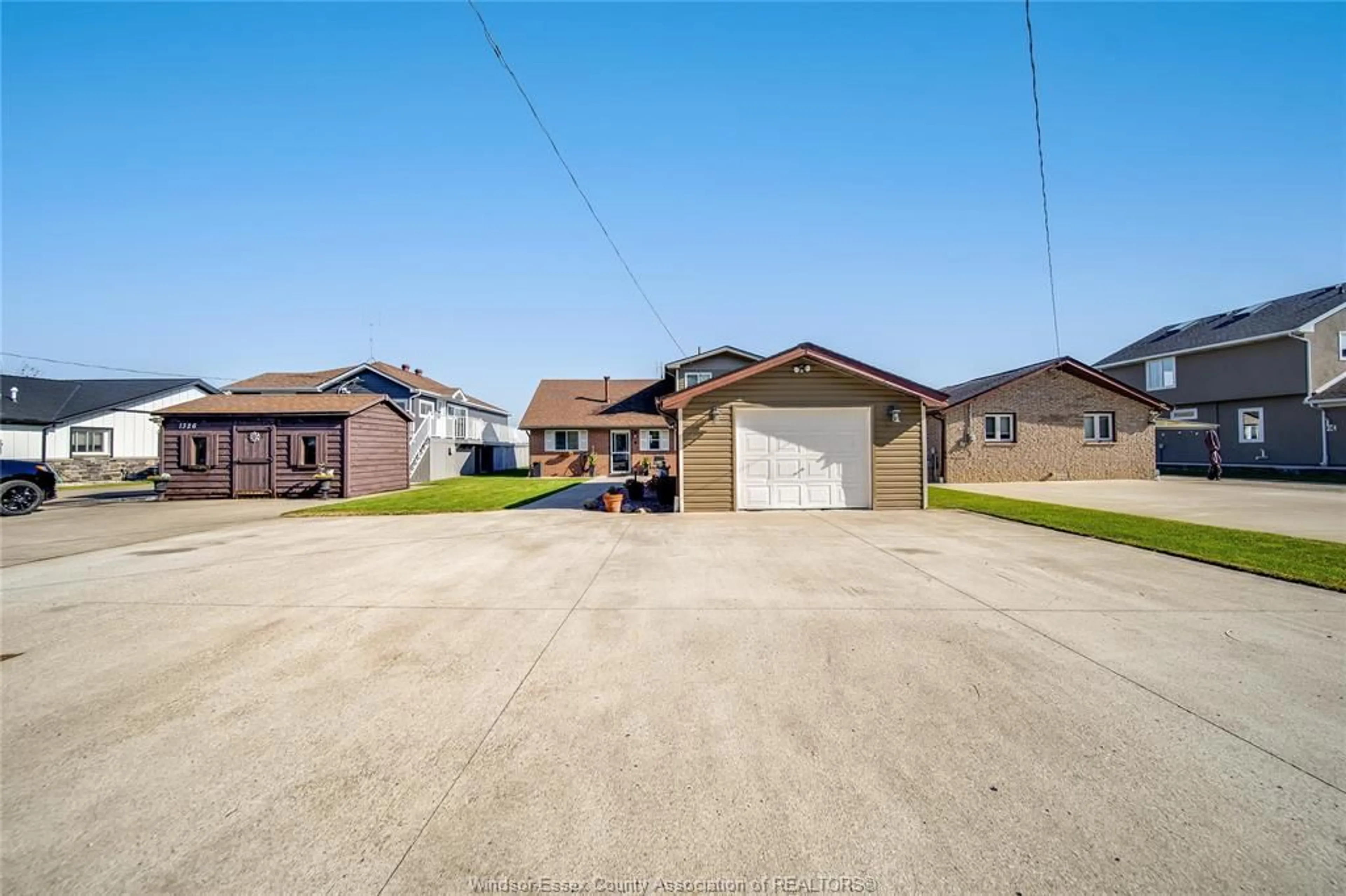 A pic from outside/outdoor area/front of a property/back of a property/a pic from drone, street for 1328 SHORELINE Ave, Lakeshore Ontario N0R 1A0
