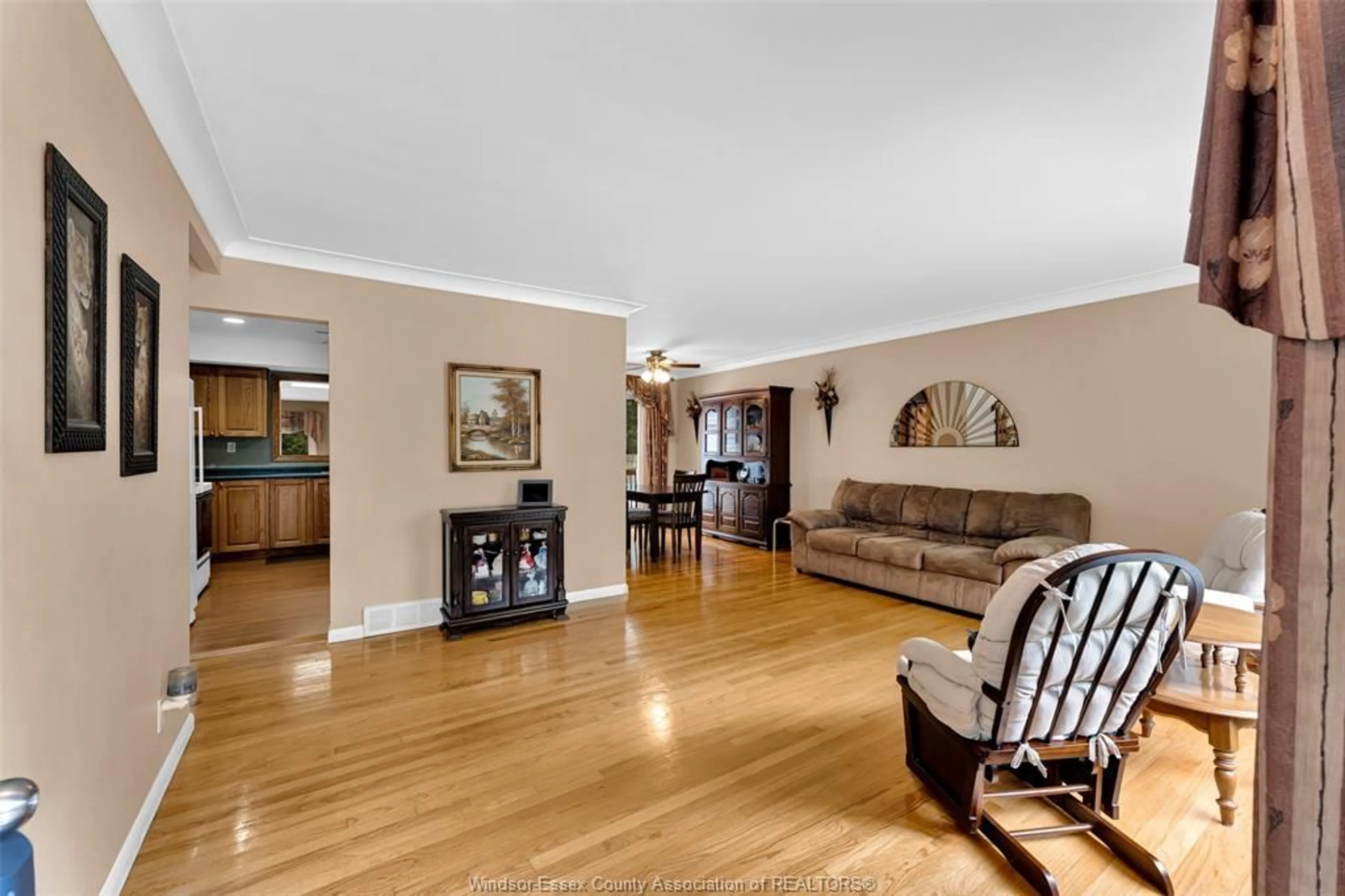 Living room with furniture, wood/laminate floor for 3415 RANDOLPH, Windsor Ontario N9E 3E9