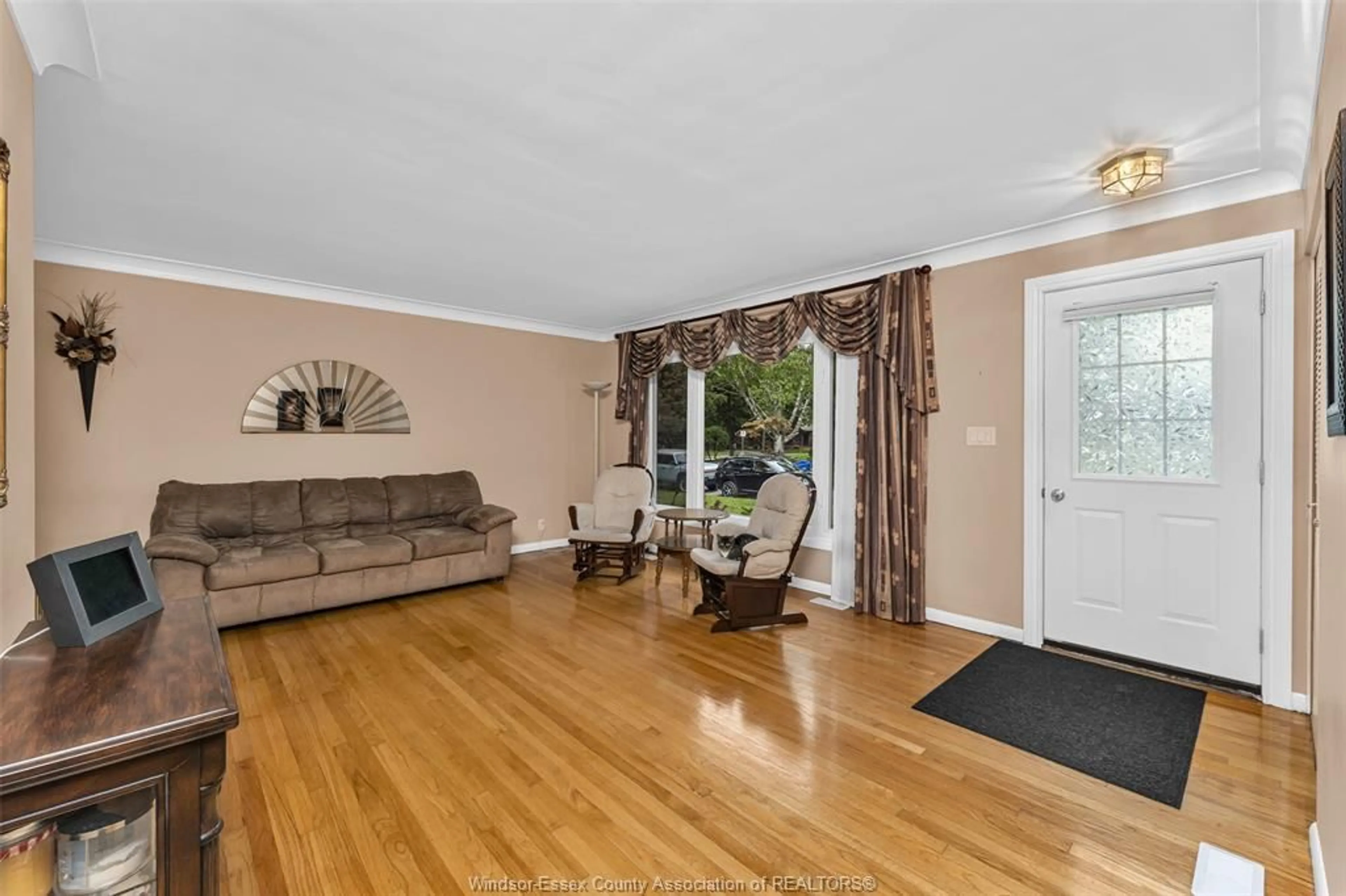 Living room with furniture, wood/laminate floor for 3415 RANDOLPH, Windsor Ontario N9E 3E9
